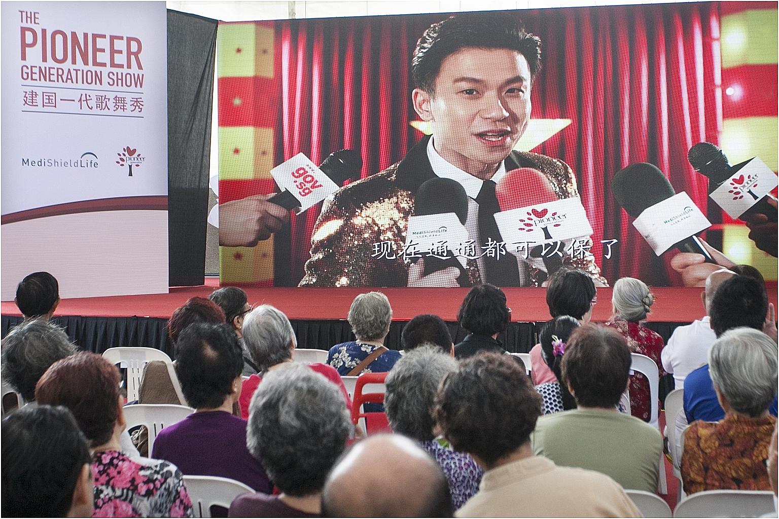 Project Superstar 2 winner Daren Tan sang a popular Sam Hui song with adapted lyrics in his Cantonese video (left) on the Pioneer Generation Package and MediShield Life. He and getai artiste Lee Pei Fen performed on stage after their videos were scre