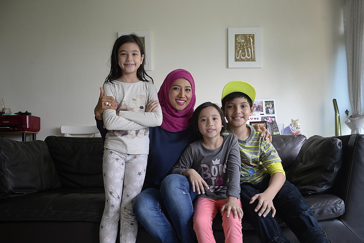 Ms Rynna Atmareh, 39, and her children (from left) Myshea, nine, Inez, seven, and Dean, 10. All three children have attended financial literacy workshops and one of them, Myshea, even won the overall award of $200 cash at the workshop that she attend