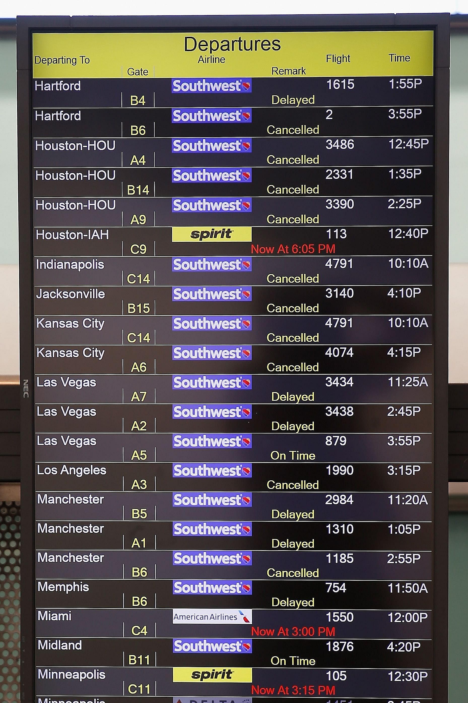 A board at the Baltimore-Washington International Thurgood Marshall Airport displays flights which had been delayed or cancelled.