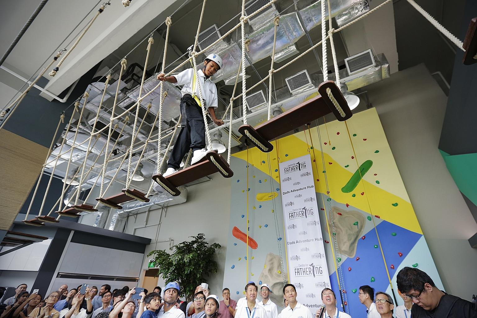 Muhammad Samir Hamzah, 13, trying out the high-elements obstacle course at the new Dads Adventure Hub at The Tennery in Bukit Panjang yesterday.