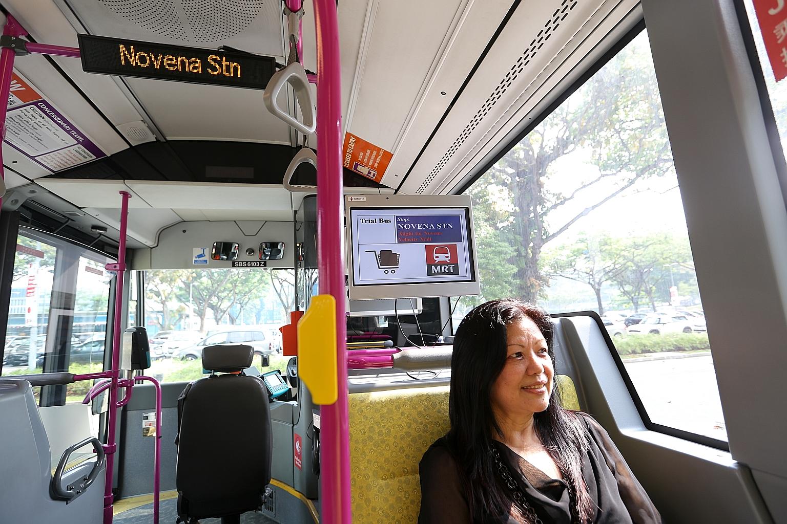 Officer manager Phyllis Chng, 62, gave her feedback on the passenger information display (above her) on trial in buses.