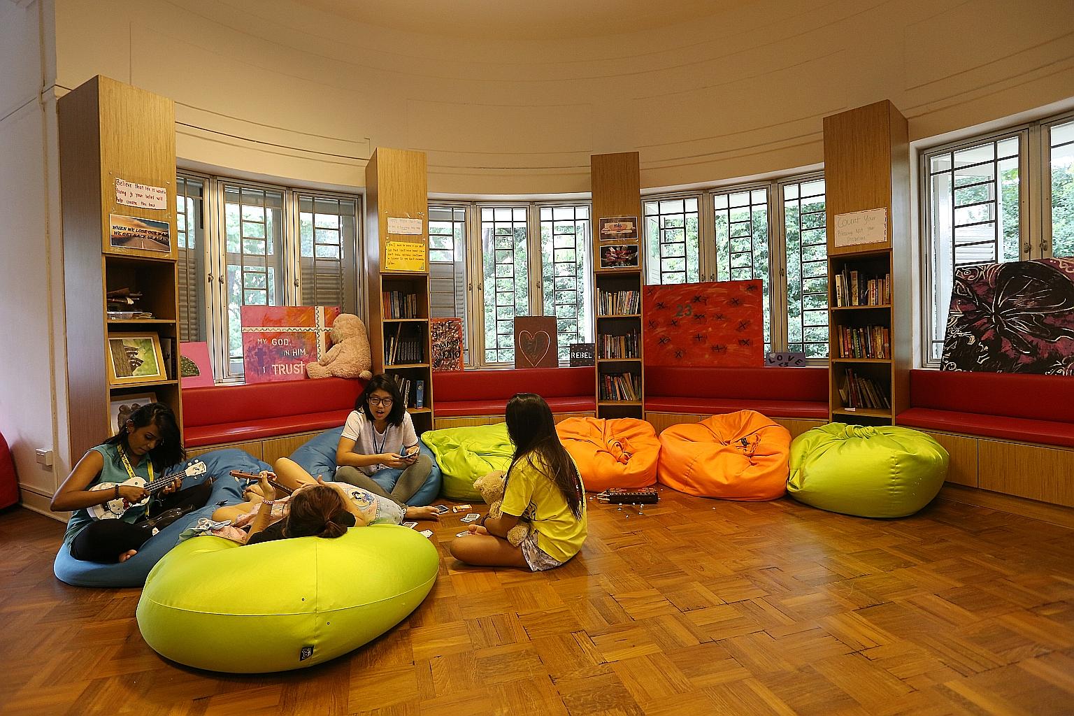 Mentors Kiara Sangiah (left), 30, and Ether Kum (third from left), 24, with two residents of the DaySpring Residential Treatment Centre, which helps abused teenage girls.