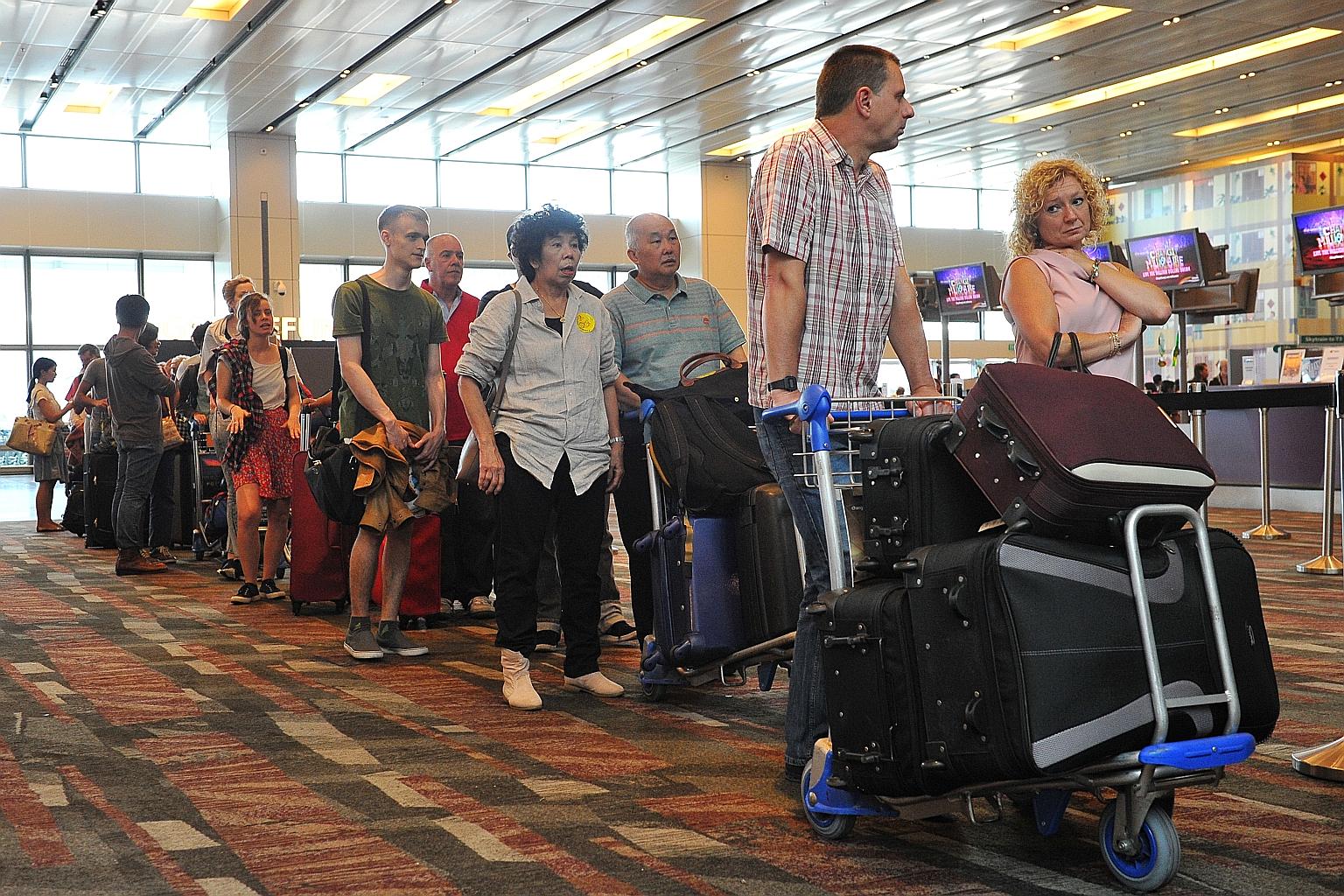 Passengers checking in at Changi Airport. Locally, many are cashing in on the stronger Singdollar to feed their yen for travel, flying off to Australia, New Zealand, China, Japan or Europe. Even with fares on the rise, keen competition between airlin