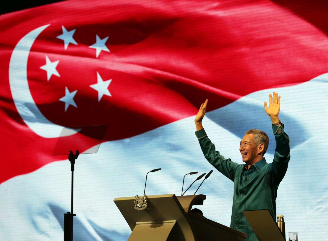 Prime Minister Lee Hsien Loong waving to the audience after his National Day Rally speech last year. The SG50 Rally tonight is an apt platform to reflect on Singapore's success and unite the nation for the road ahead.