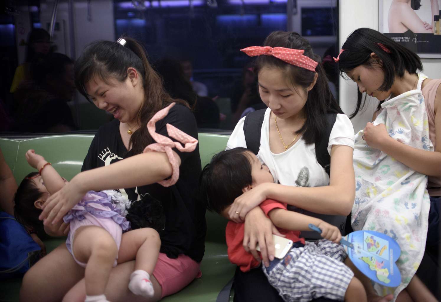 Mothers breast-feeding their babies in a commuter train as part of World Breast-feeding Week last month. Supportive employers and colleagues, as well as having a private space in the office, are factors that help make the breast-feeding journey successful