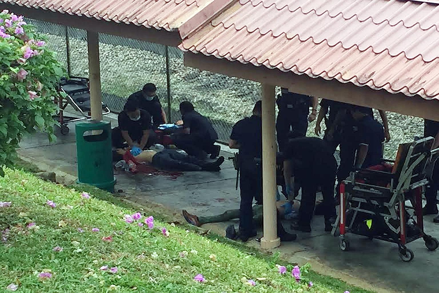 The suspect (above, lying on the ground), 39, was arrested for allegedly stabbing a 48-year-old man repeatedly at a covered walkway near Ang Mo Kio MRT station during yesterday's morning rush hour.
