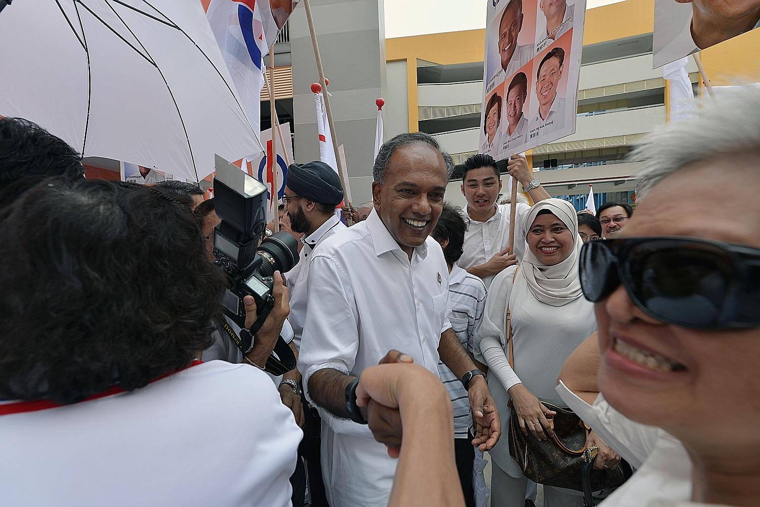 Law and Foreign Minister K. Shanmugam (at left) says that based on the WP chairman's and Hougang MP's speeches, they have their eye on forming the government in the future.