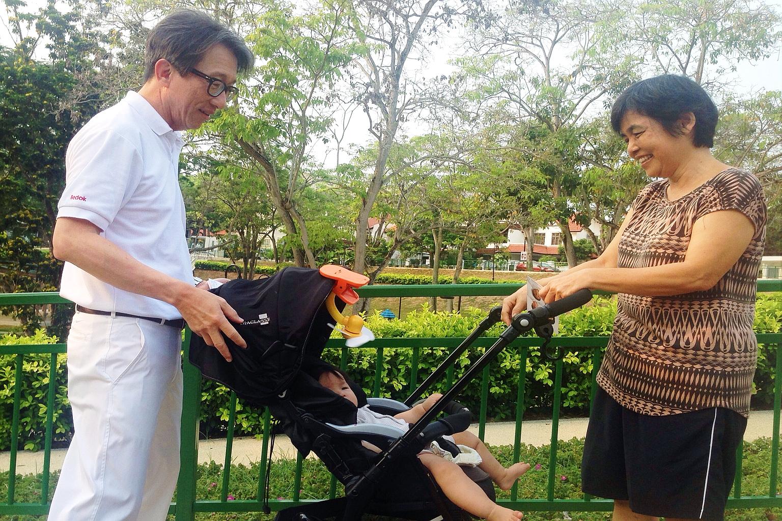 Mr Lim Swee Say, who is leading a PAP team to contest in East Coast GRC, on a walkabout in Lucky Heights yesterday.
