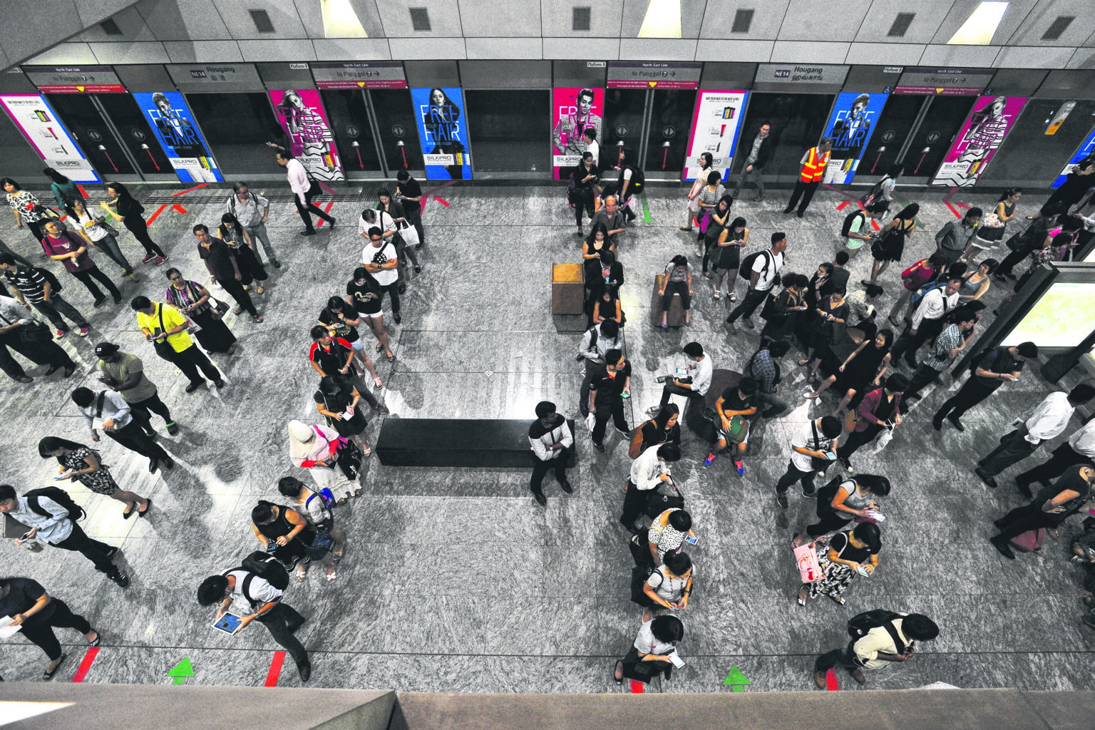 The crowd inside Hougang MRT station (left) at 10.24am yesterday. SBS Transit said service resumed at 10.28am - nearly 31/2 hours after the first glitch occurred.