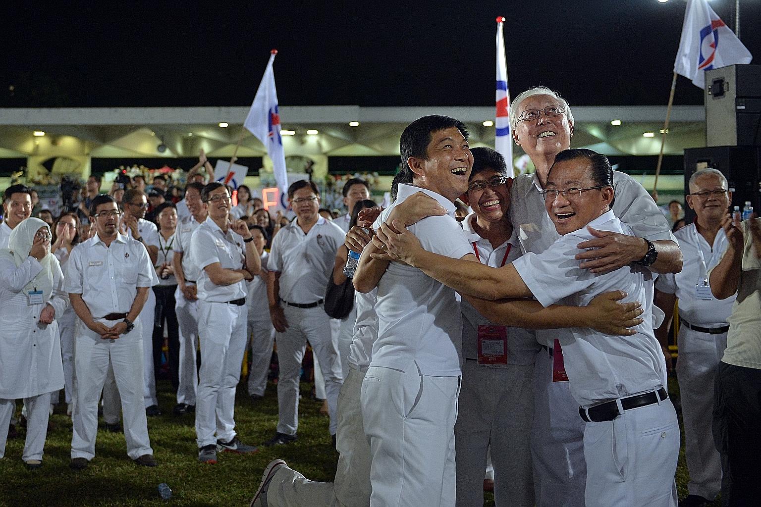 (From left) WP's Mr Terence Tan, Mr Yee Jenn Jong, Mr Daniel Goh, Ms He Tingru, Mr Firuz Khan, and Mr Dylan Ng waiting for the results at Hougang Stadium.