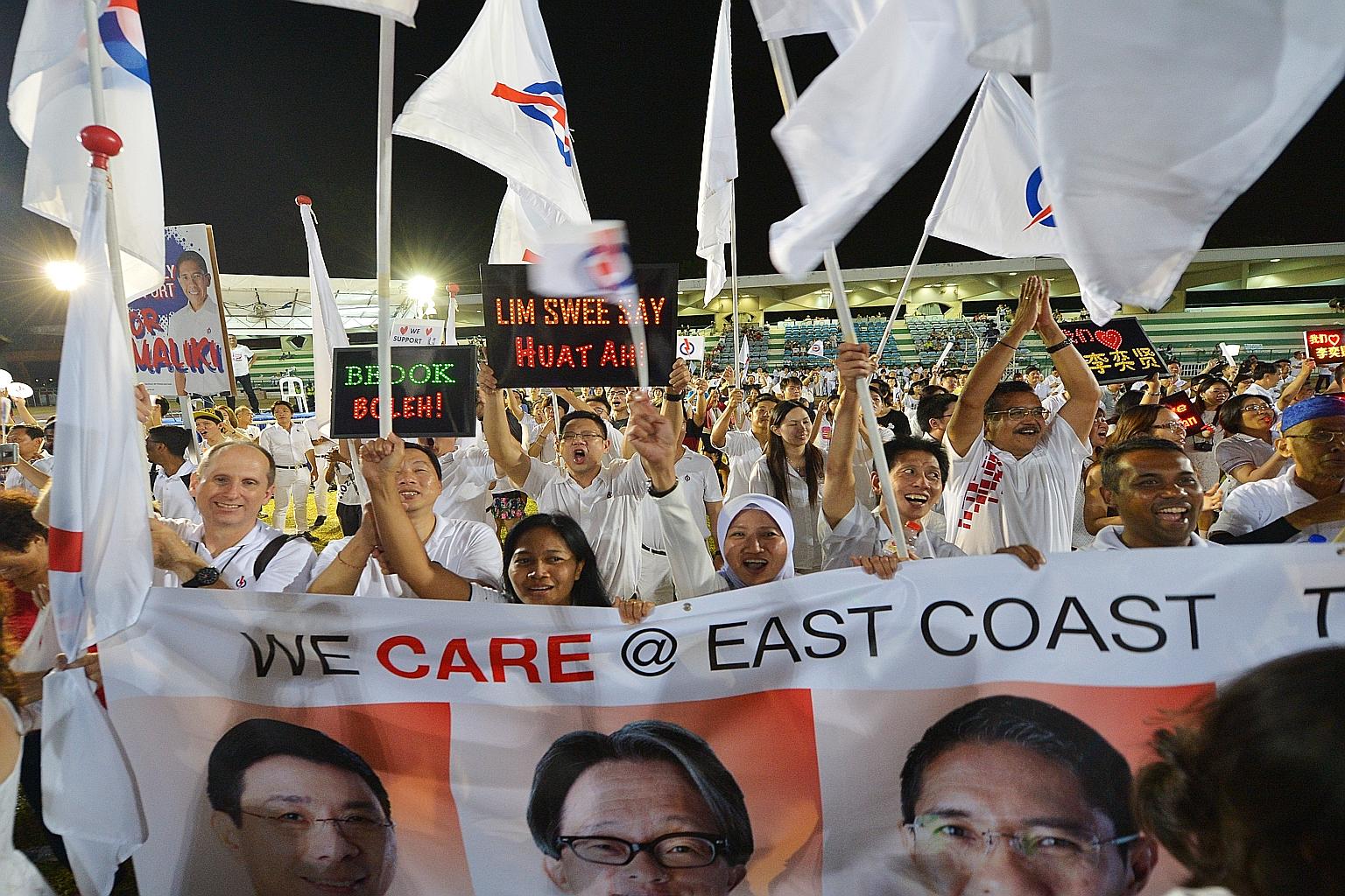 Jubilant PAP supporters greet the East Coast GRC team, comprising Mr Lim Swee Say, Mr Lee Yi Shyan, Dr Mohamad Maliki Osman and Ms Jessica Tan, with a rockstar reception.