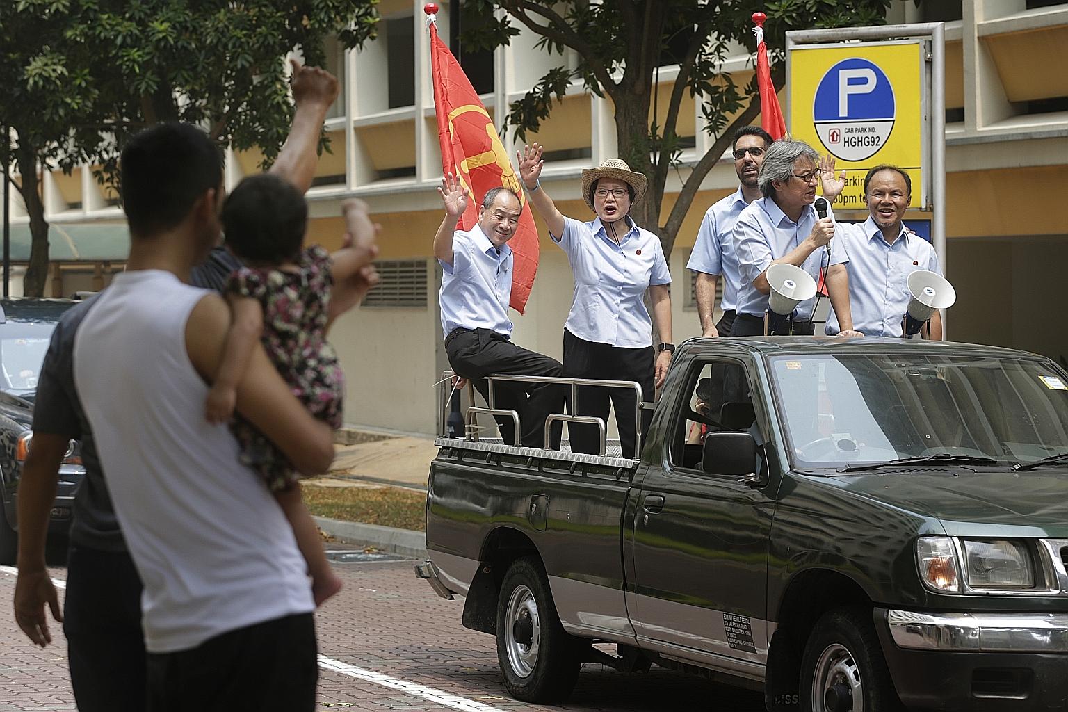 The Workers' Party team for Aljunied GRC, comprising (from left) Mr Low Thia Khiang, Ms Sylvia Lim, Mr Pritam Singh, Mr Chen Show Mao and Mr Muhamad Faisal Abdul Manap thanking residents in Kovan yesterday.