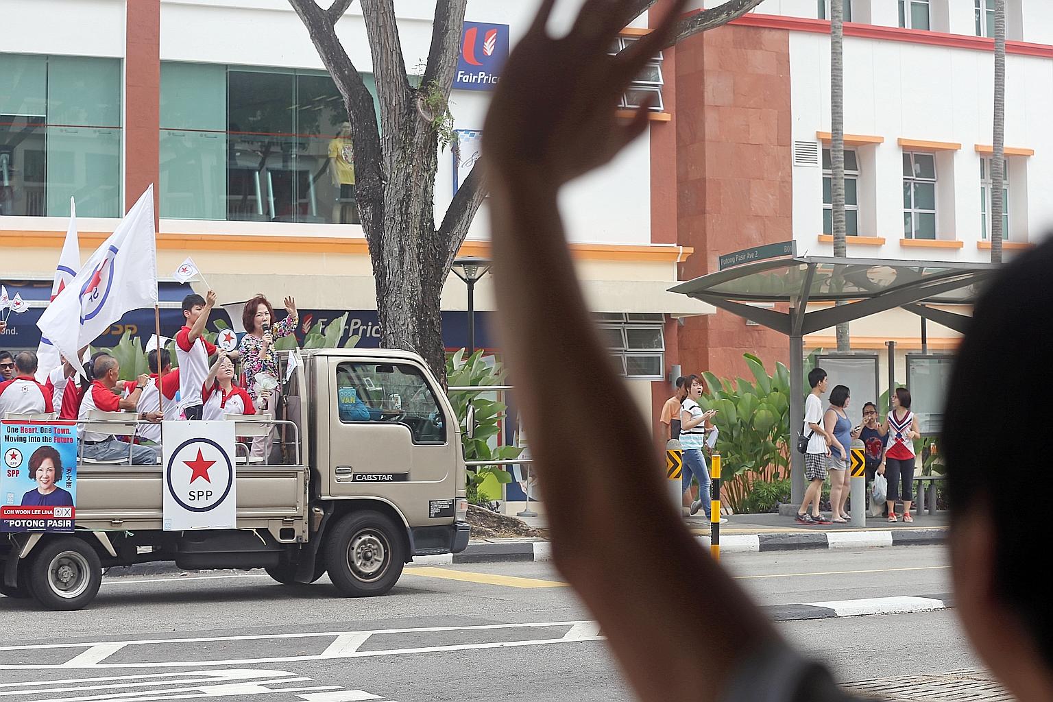 Mrs Lina Chiam and party members waving to residents in Potong Pasir from the SPP lorry, which also went around Sennett Estate before ending at Toa Payoh Lorong 8.