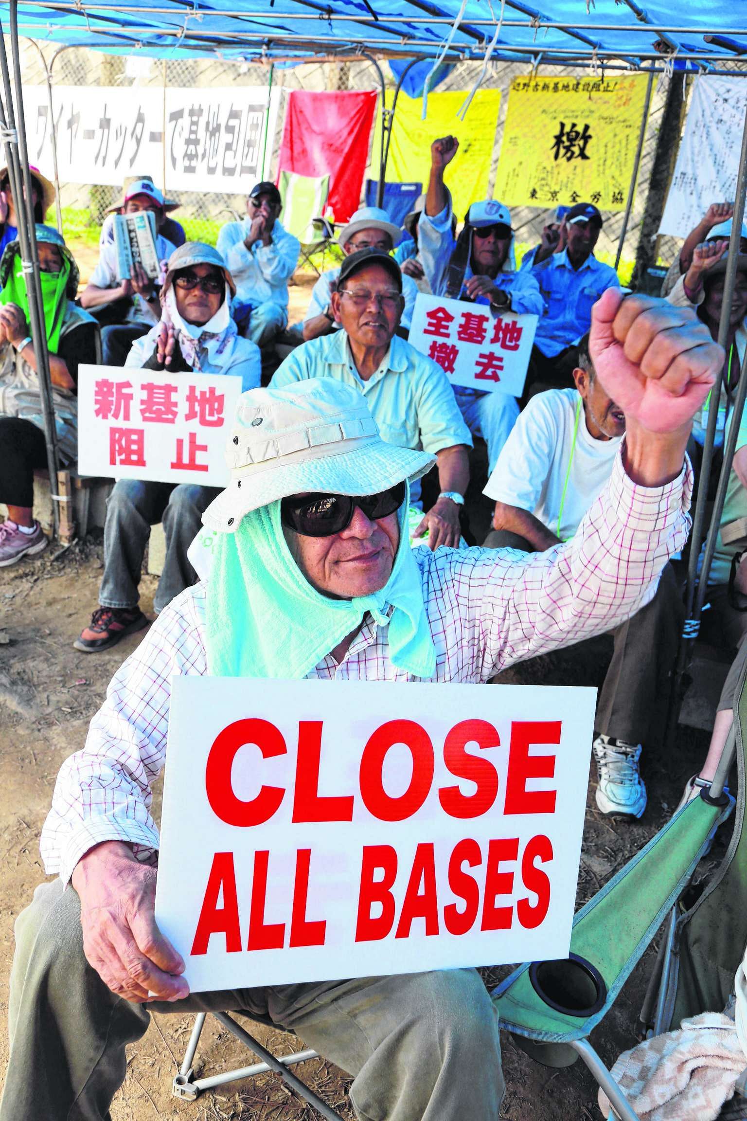 Protesters in Nago, Okinawa, making their stand yesterday against plans for a new US airbase on the southern Japanese island.
