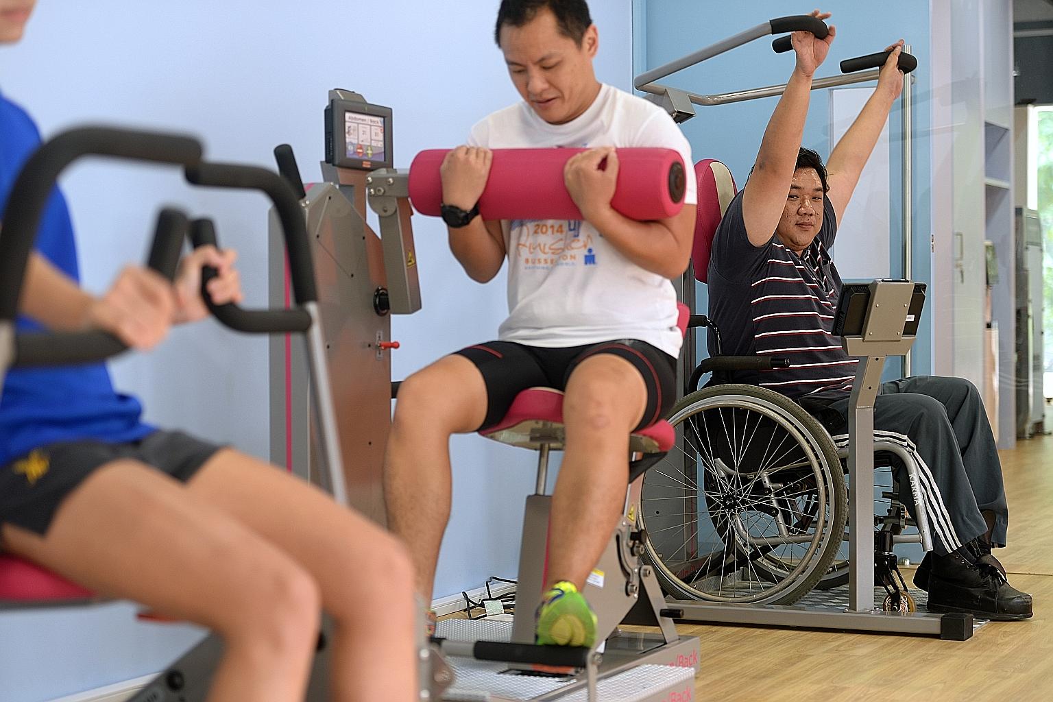 Adaptive Gym Equipment: diverse group of people using adaptive gym equipment in a modern, well-lit fitness facility — wheelchair users, older adults, and people with varying abilities training side by side.