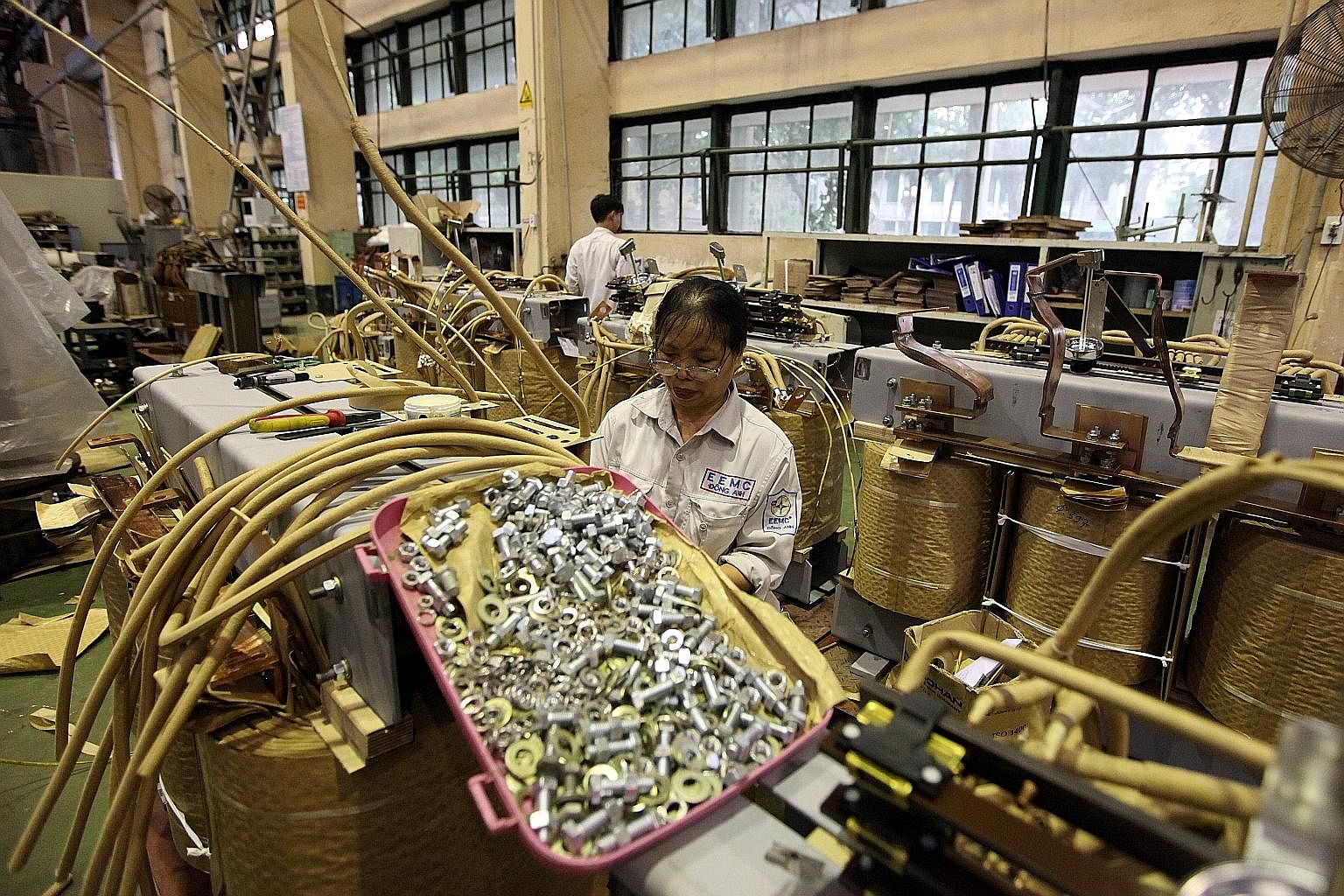 Workers in a transformer manufacturing workshop in Hanoi. Vietnam's manufacturing and export sector has traditionally focused on the US and European markets.