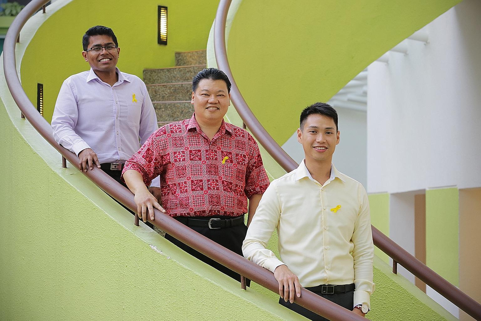 Mr Mohamed Fazly (far left) says volunteers on the SPS' befriending programme such as Mr Azman Osman (centre) are part of a vital support system for former offenders. Mr Azman and Mr Tan Han Yao (at right), who tutors inmates taking their O levels at