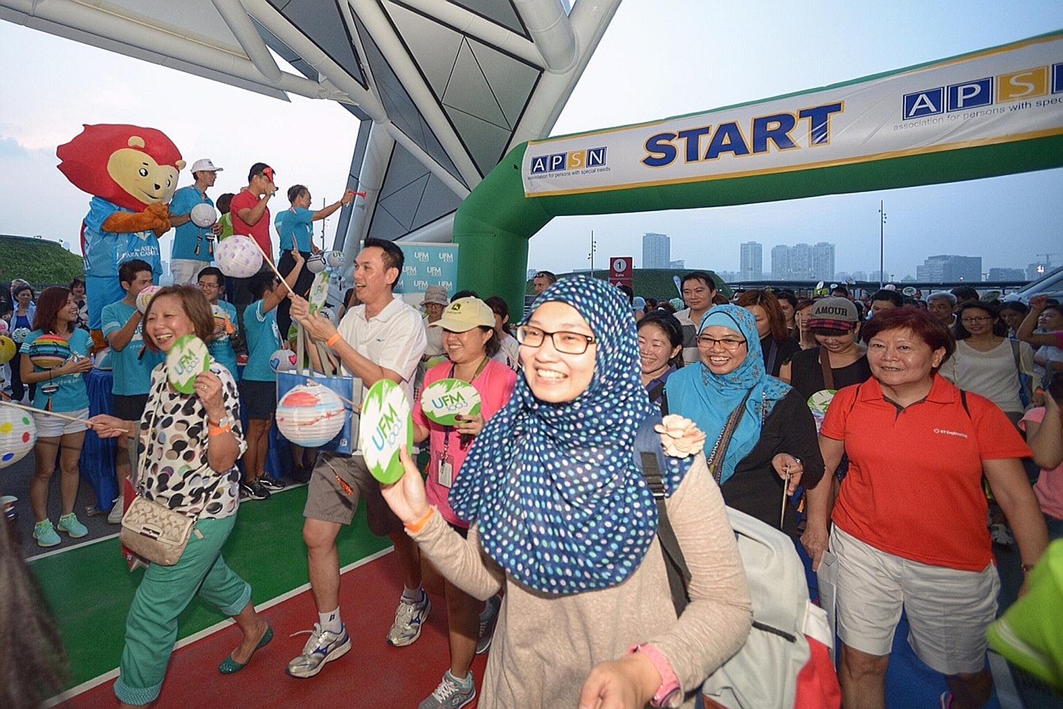 The haze did not cloud the enthusiasm of participants in a 1.4km walkathon at the Singapore Sports Hub, organised by the Association for Persons with Special Needs.