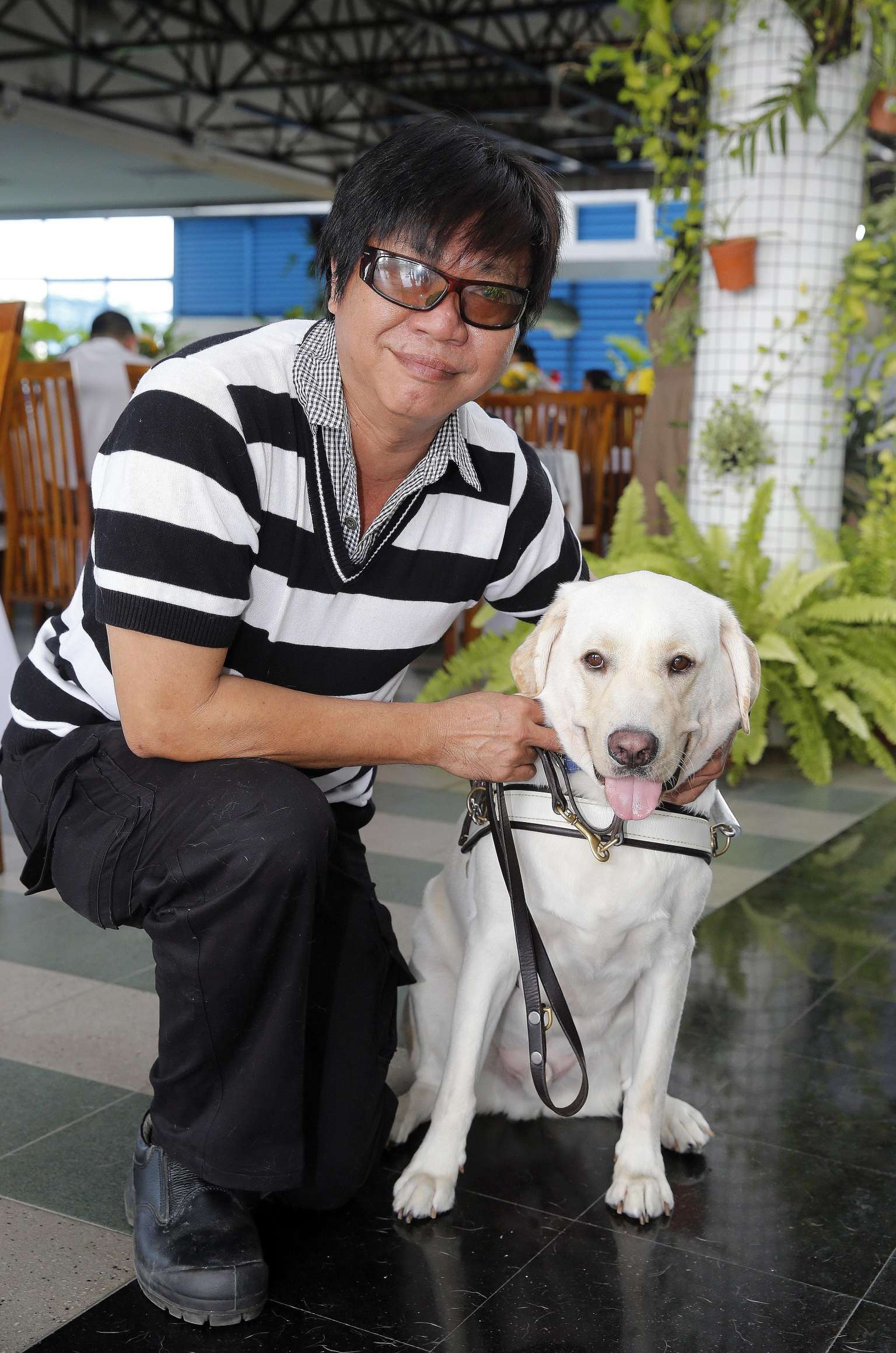 Mr Gary Lim, 55, has since built a strong bond with his guide dog Jordie, which he calls "his third son"