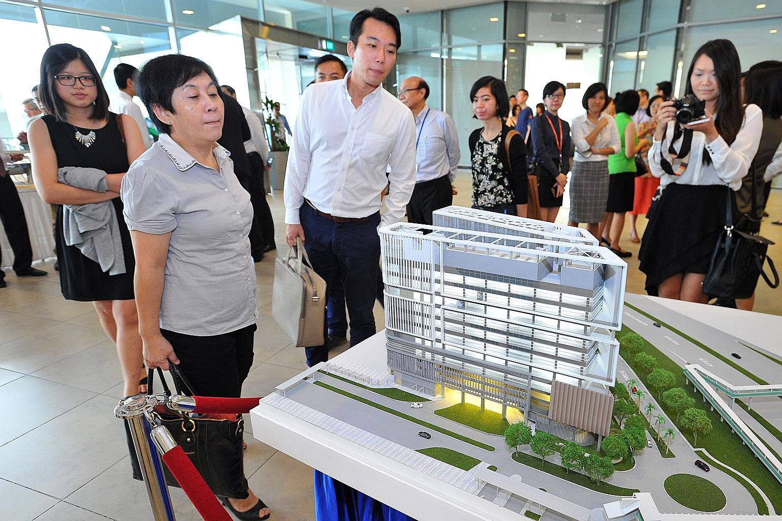 A model of the National University Centre for Oral Health, which will open in 2019 at Kent Ridge. It will focus on complicated cases, such as treatment for transplant patients, as well as dental care for the elderly.
