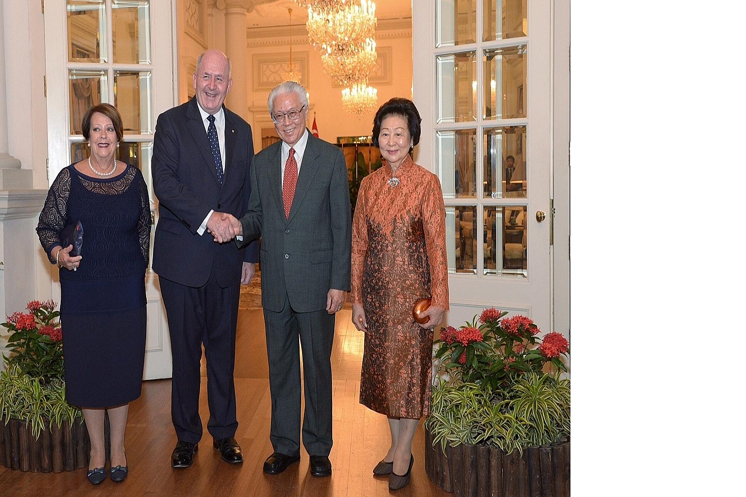 President Tony Tan Keng Yam and his wife Mary welcoming Australia's Governor-General Peter Cosgrove and his wife, Lady Lynne Cosgrove, at the Istana yesterday during their four-day visit to the Republic.