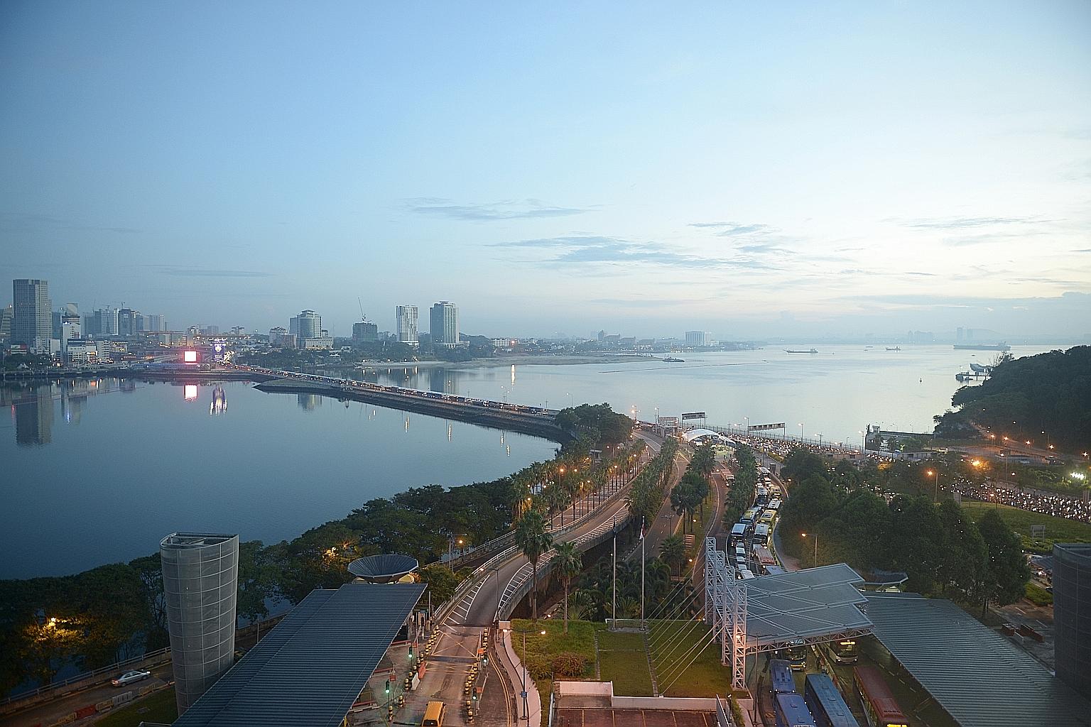 Traffic at the Woodlands Checkpoint and along the Causeway. About 74,000 drivers of Singapore-registered vehicles have submitted Vehicle Entry Permit applications since Aug 15, when online registration began.