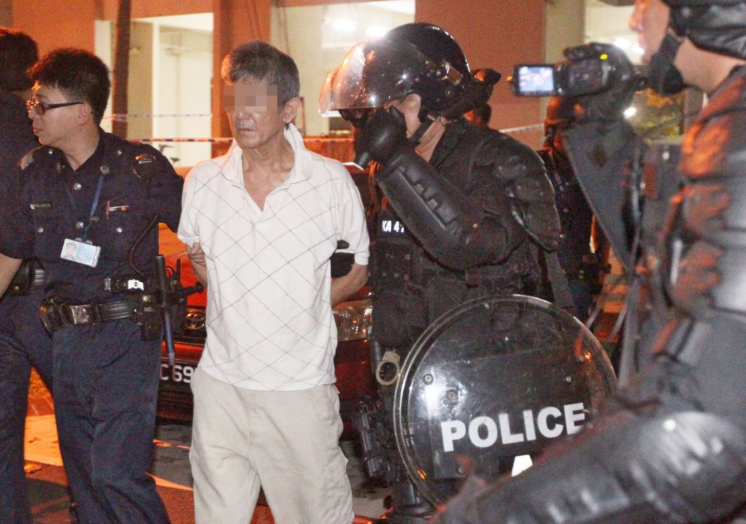 Riot police arrest man who threatened to kill landlady | The Straits Times