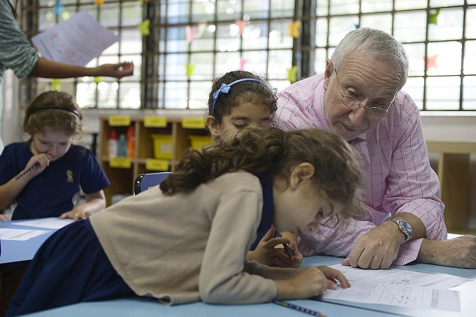 Dr Daniel Kahn, head of the Sir Manasseh Meyer International School, with some of its pupils.