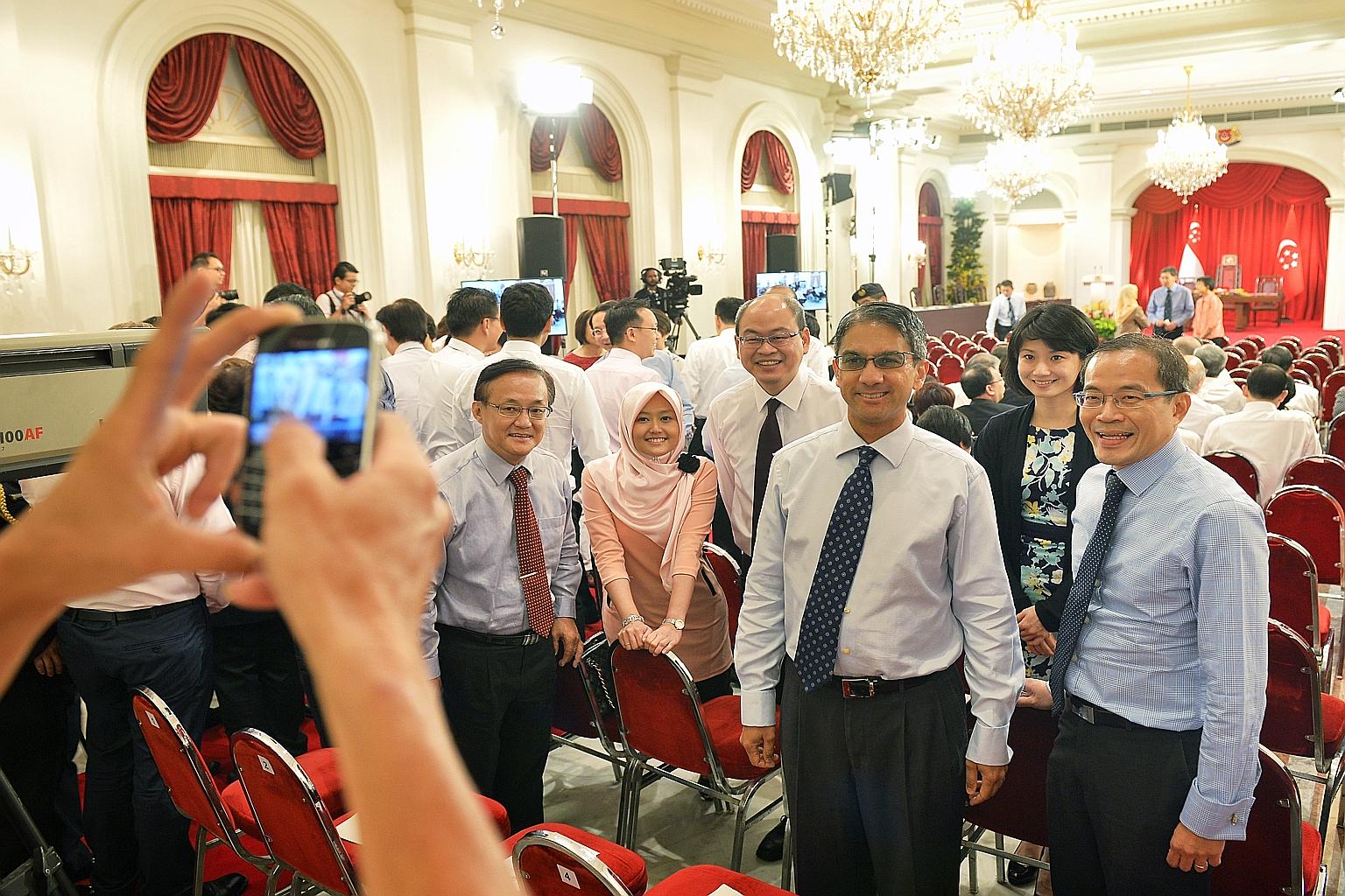 WP Non-Constituency MPs Dennis Tan (right) and Leon Perera (third from right) at the swearing in of the new Cabinet at the Istana on Oct 1. The two men are part of the party's next-generation leaders, and the party's renewal plans appear to be on tra