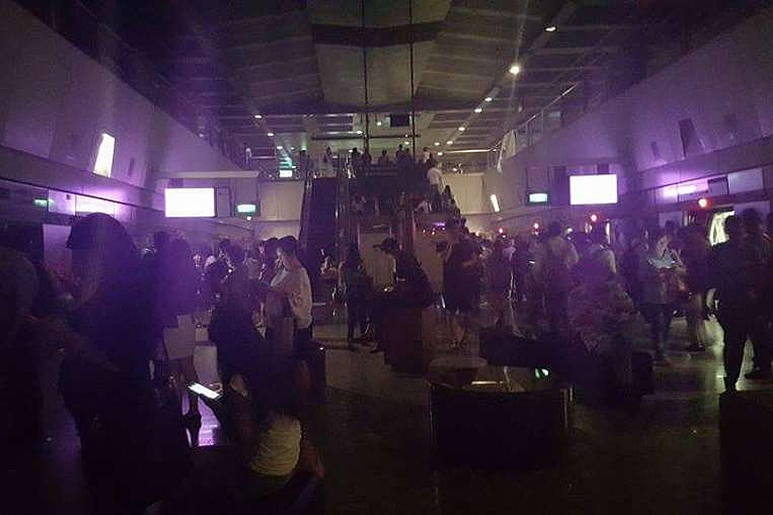 Commuters at Hougang MRT station during rush hour yesterday morning, when a power fault caused blackouts at several stations and disrupted train services on the North-East Line. Normal service resumed at 9.30am.