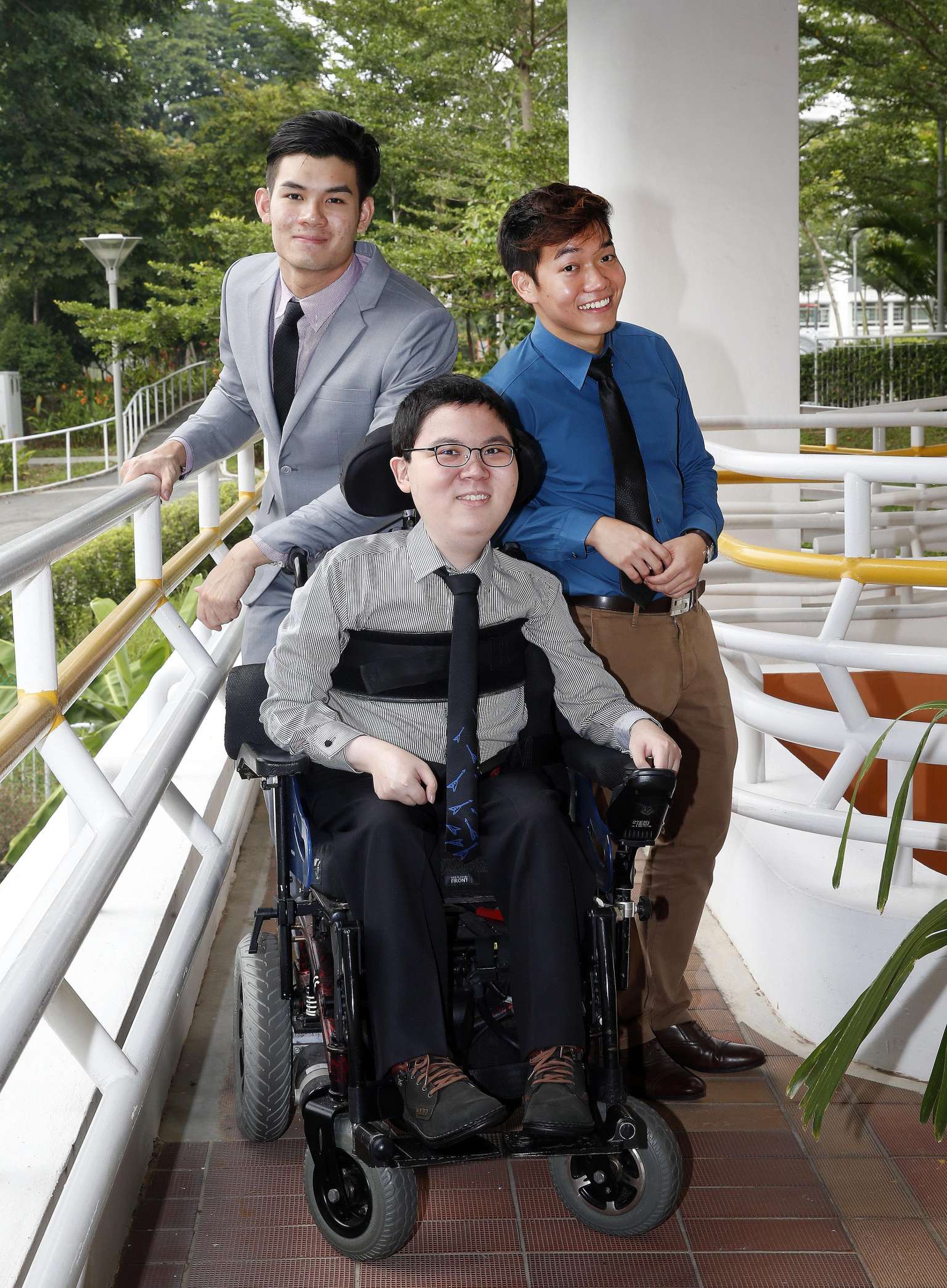 (From left) Mr Bryan Chong, 22, Mr Shalom Lim, 20, and Mr Josiah Ong, 22, received the Asia Pacific Breweries Foundation Scholarship for Persons with Disabilities yesterday at the SPD Ability Centre. It is the eleventh year the scholarship, which sup