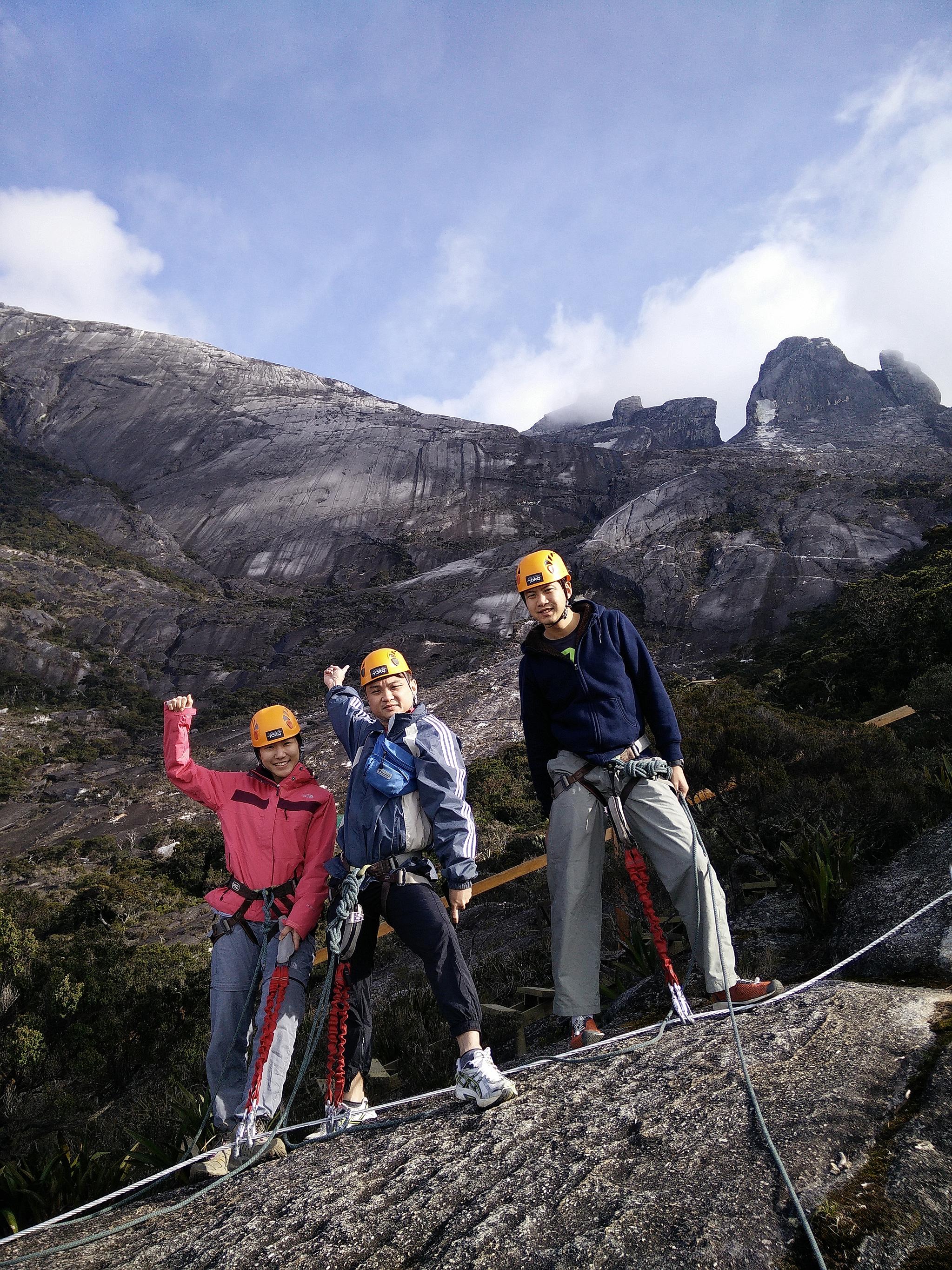 Ex-colleagues (from left) Tan Ken Li, Ang Chee Leng and Adrian Kok are among the latest from Singapore to climb Mount Kinabalu. The earthquake there killed 18 in June.