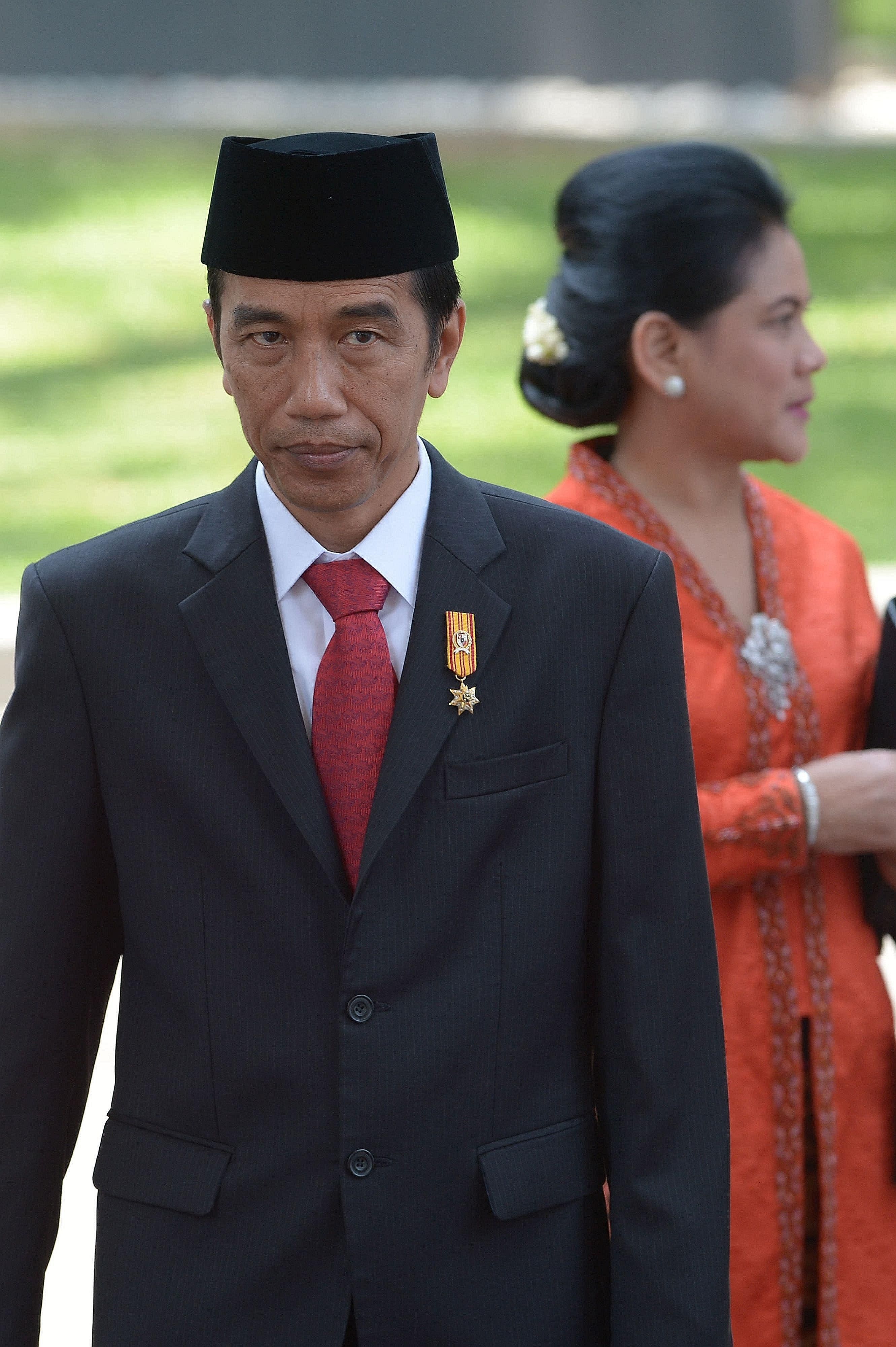 Indonesian President Joko Widodo with his wife Iriana Widodo at the presidential palace in Jakarta. President Joko's humility and approachability have endeared him to Indonesians. He embodies the way in which a people's democracy can unite to fight t