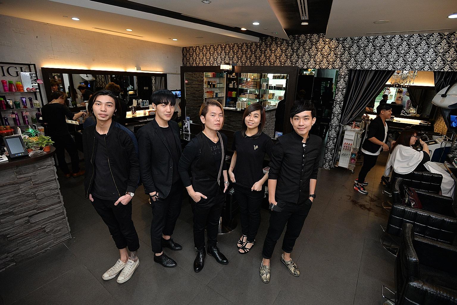 Vintage Studio director Vincent Ang (centre) with hairstylists (from left) Eugene Ng, Dowan Kim, Tracey Chin and Kidd Liang at the chain's Westgate outlet.