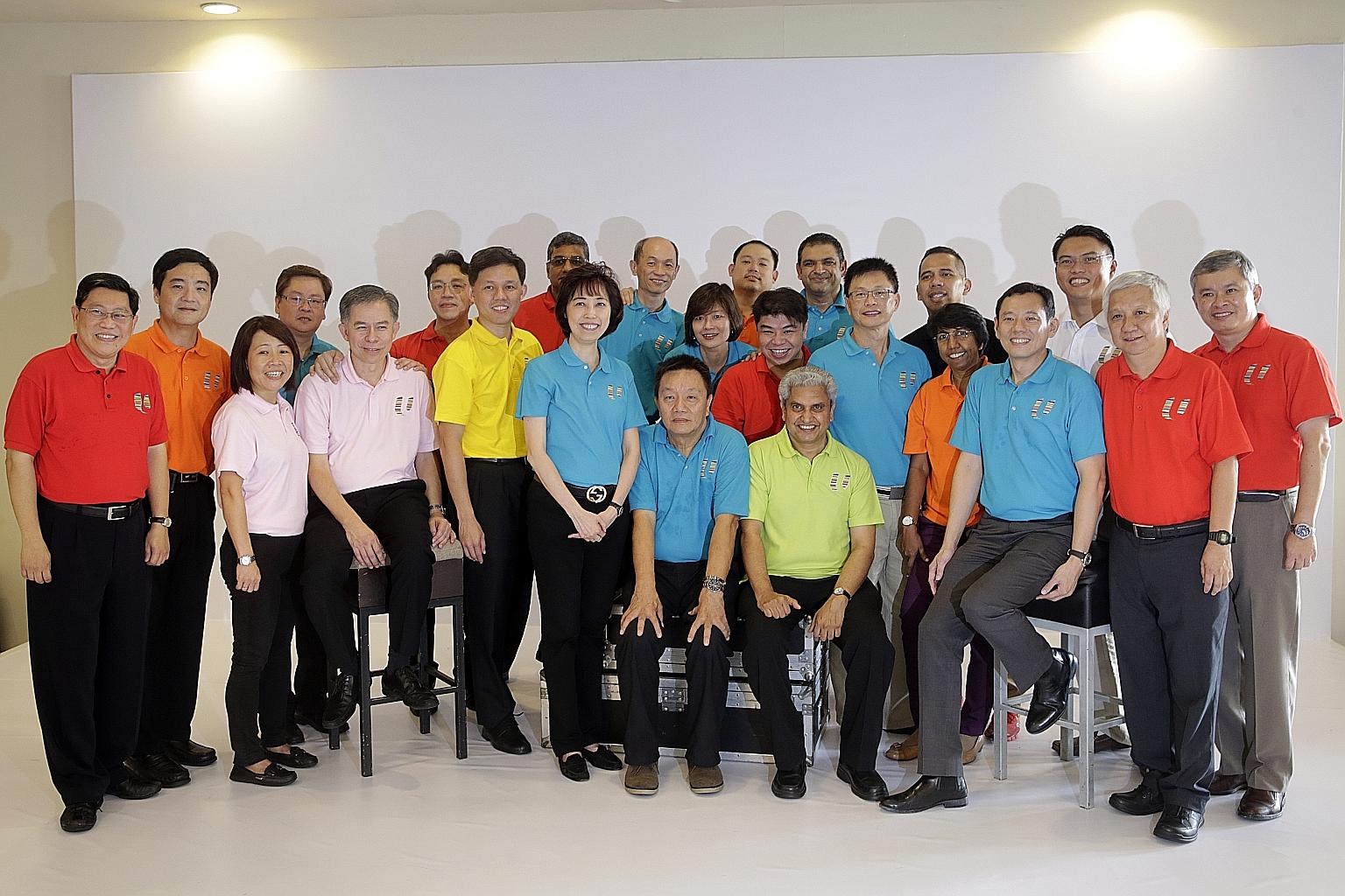 Former MP Yeo Guat Kwang (far left) and labour MP Ang Hin Kee (far right) with the new central committee members (from left to right): Mr Heng Chee How, Ms Eileen Yeo, Mr Richard Tan, Mr Yeo Chun Fing, Mr Benjamin Tang, secretary- general Chan Chun S