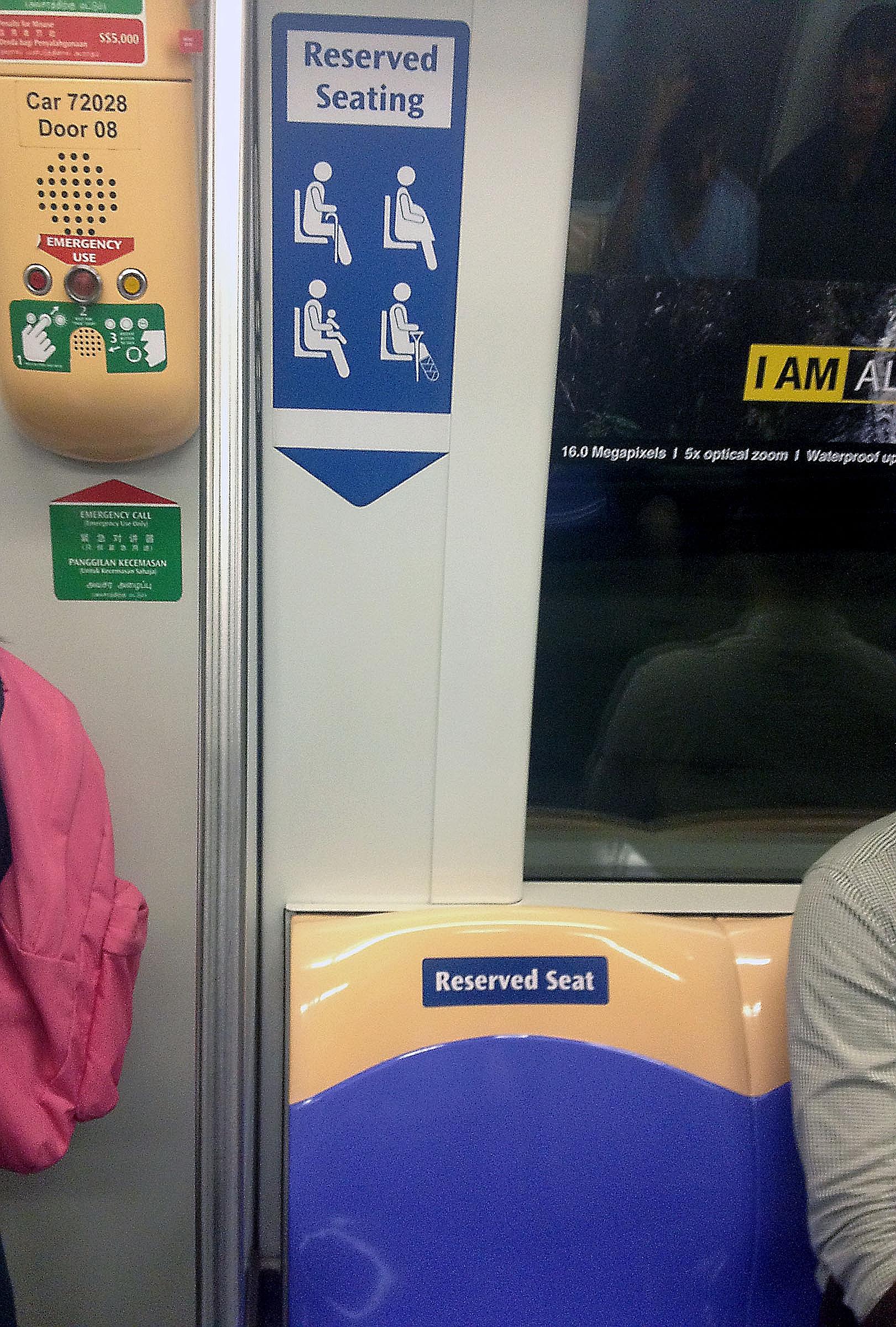 A reserved seat on an MRT train. Such seats are meant for commuters who who have a greater need to sit down, such as the elderly, pregnant women, people carrying babies or young children, and people with disabilities.