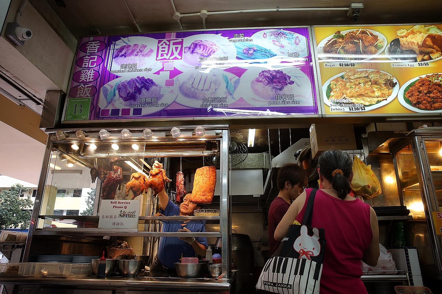 Mr Lim Kah Chai (in blue), 51, who owns Chai Hock Eating House in Toa Payoh, does not display the prices of the chicken dishes he sells. He said it would be a hassle should he need to change the items. Besides, most of his customers are regulars who