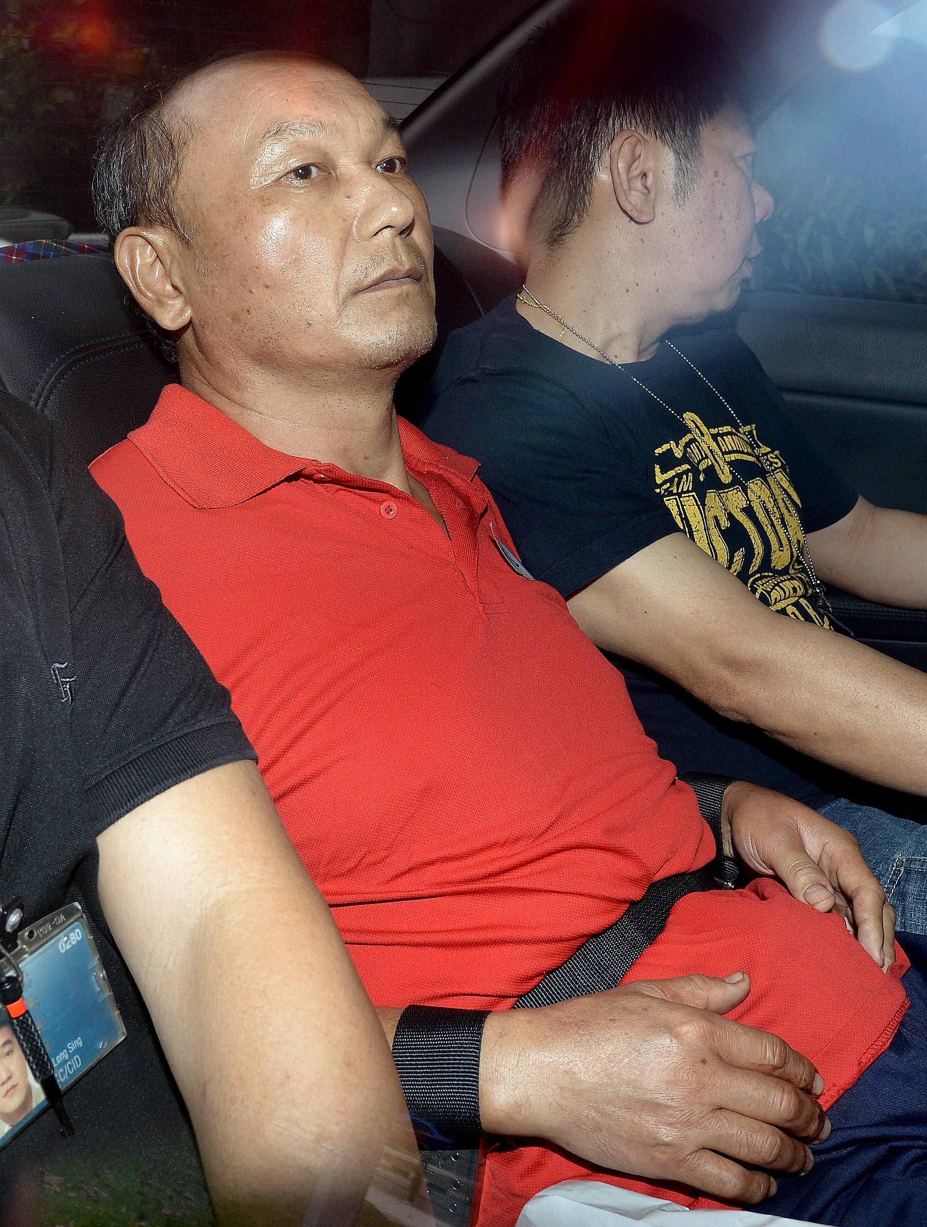 Chinese national Hu Ziqing (in red) was jailed 10 years yesterday after he pleaded guilty to a charge of culpable homicide for strangling his wife on Aug 8, 2013.
