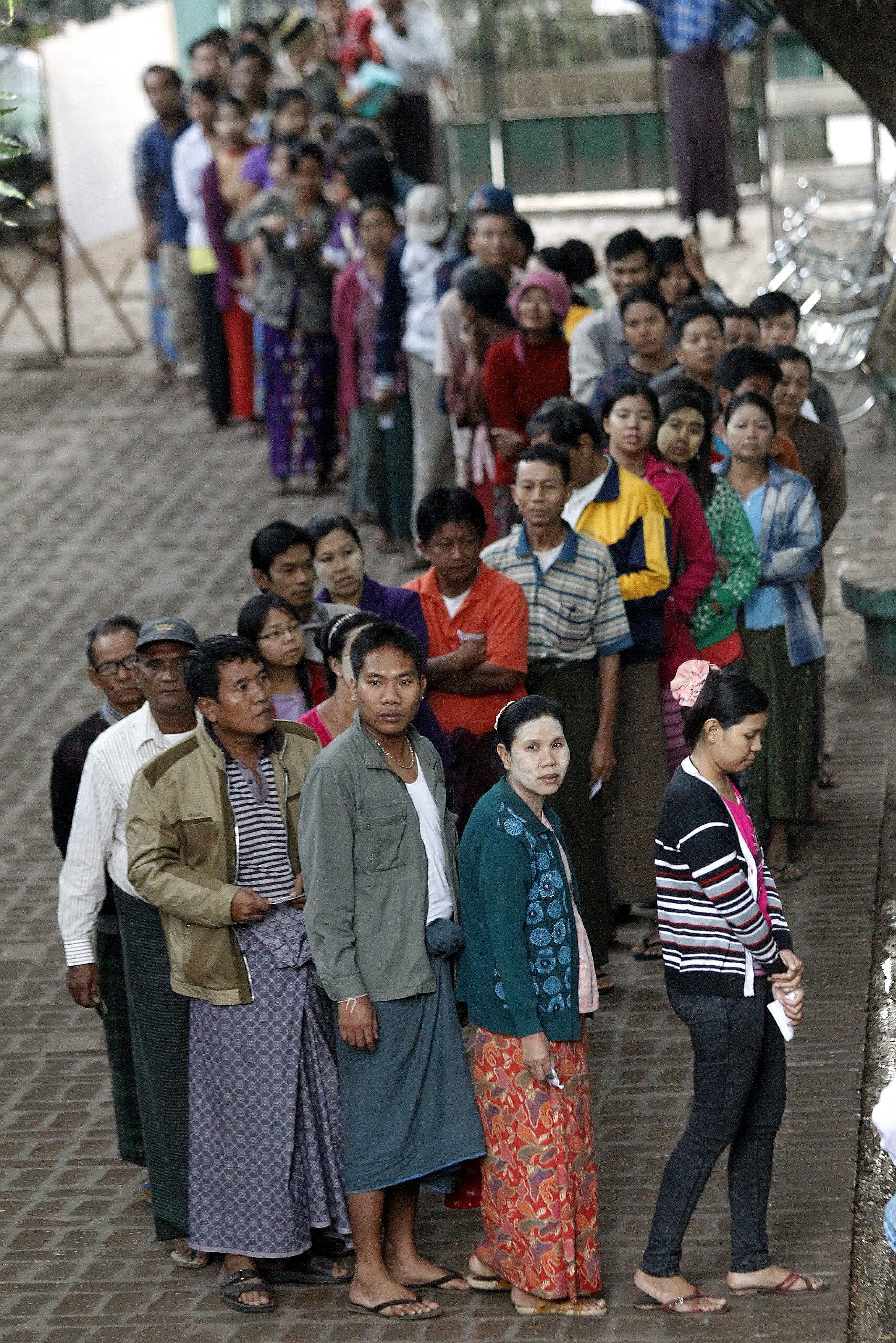 People waiting to vote at a polling station in Mandalay yesterday.