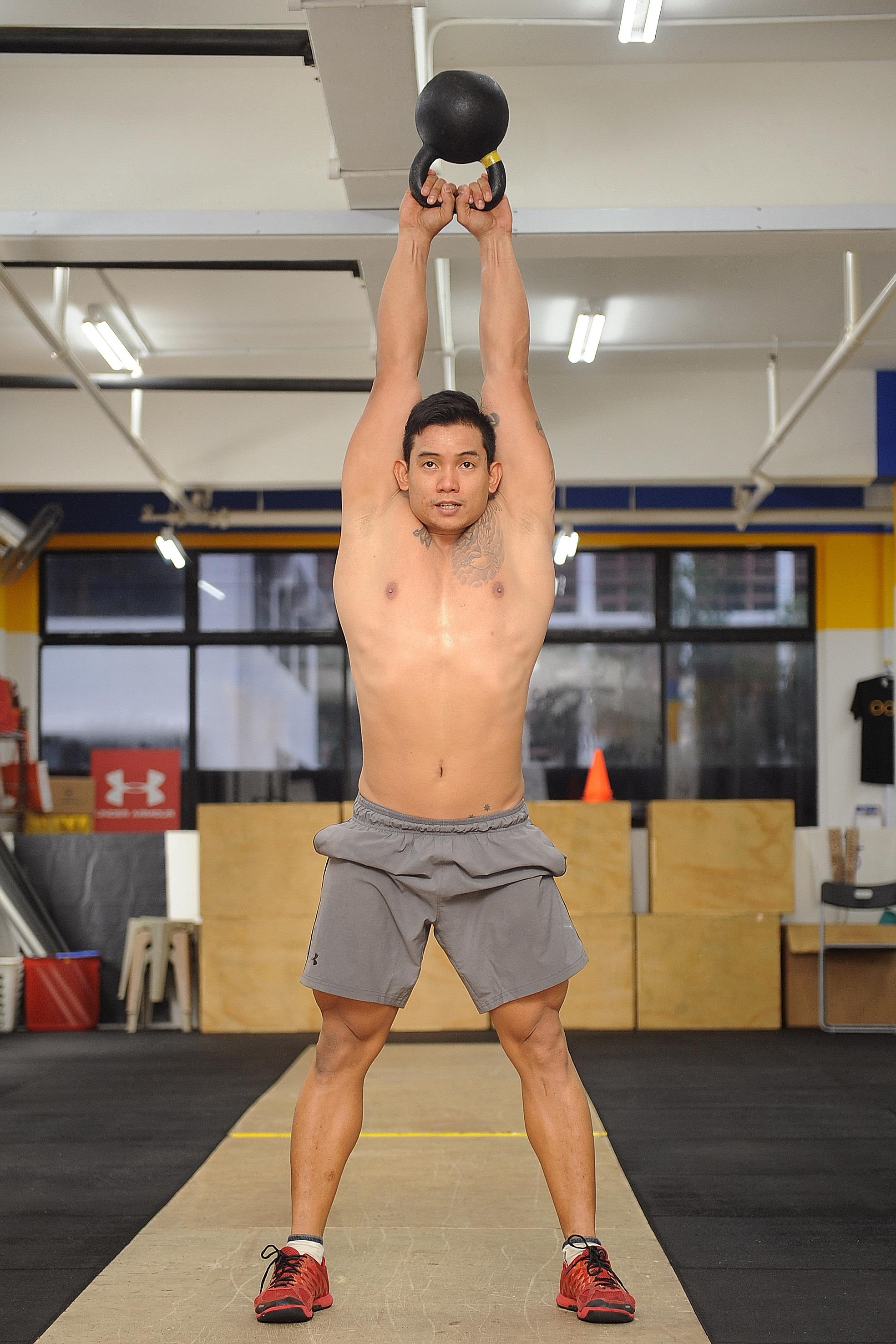 Mr Leonard Kong, 31, doing kettlebell swings, one of the CrossFit exercises.