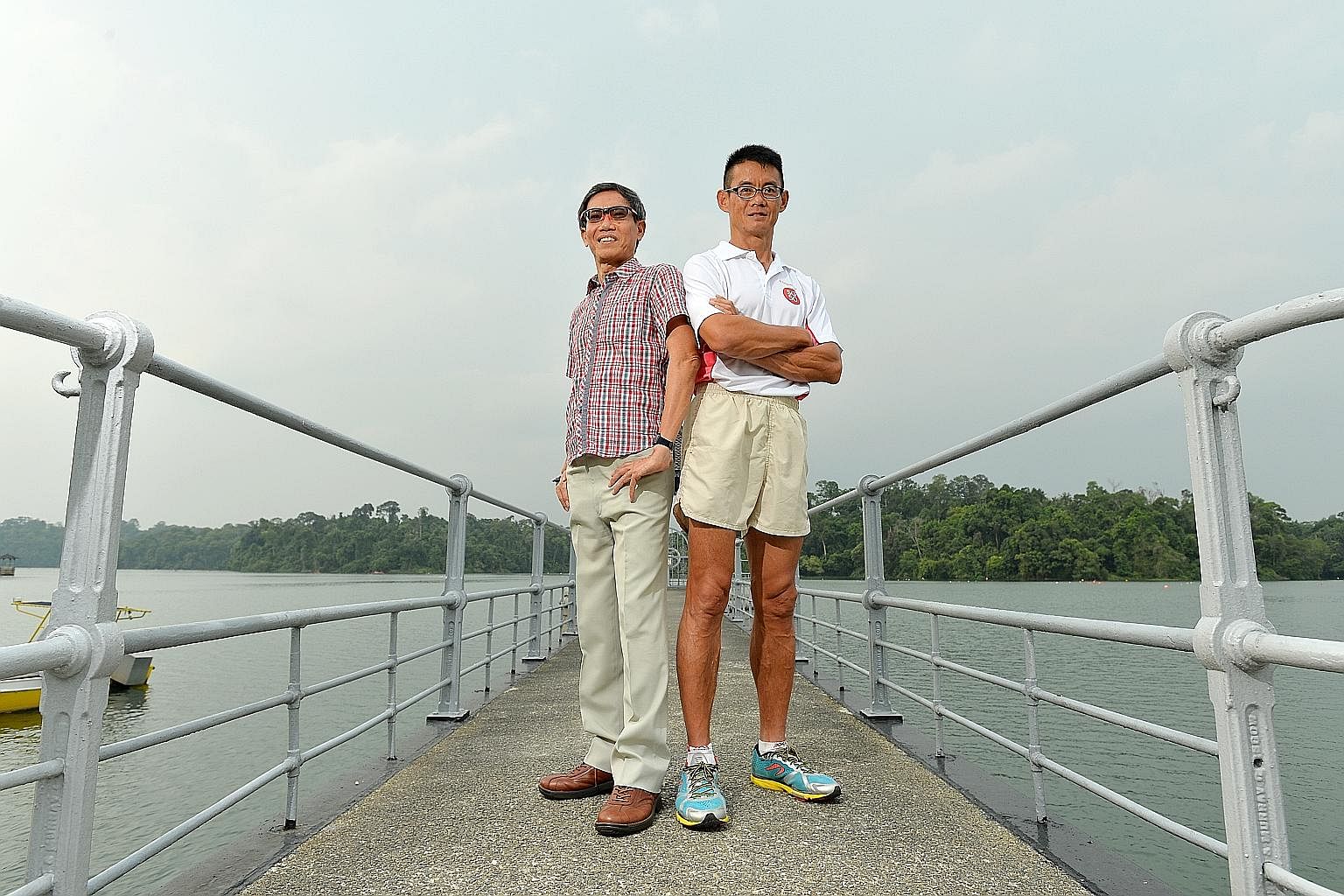 Ultramarathoners Lim Nghee Huat (left) and Yong Yuen Cheng ran 2,500km in 50 days to mark Singapore's jubilee.
