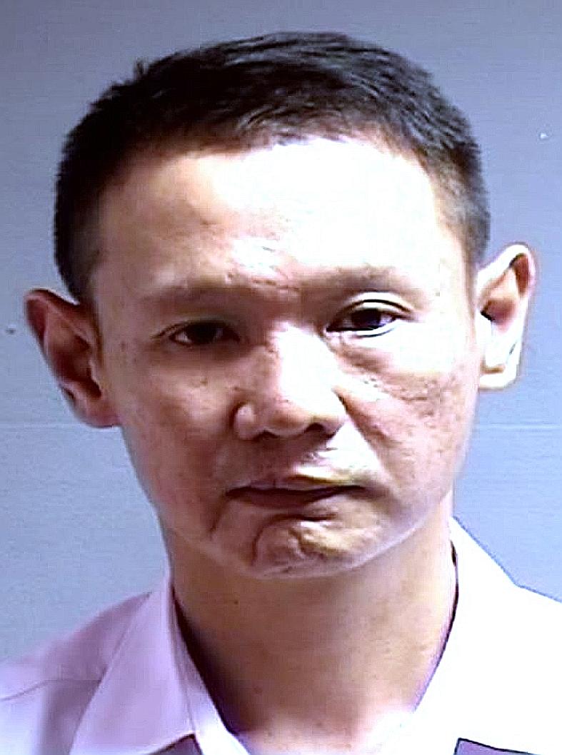Tan Wei Yong (left) threw a punch at Mr Teng Teng Yao and bit off part of his left ear during a row.