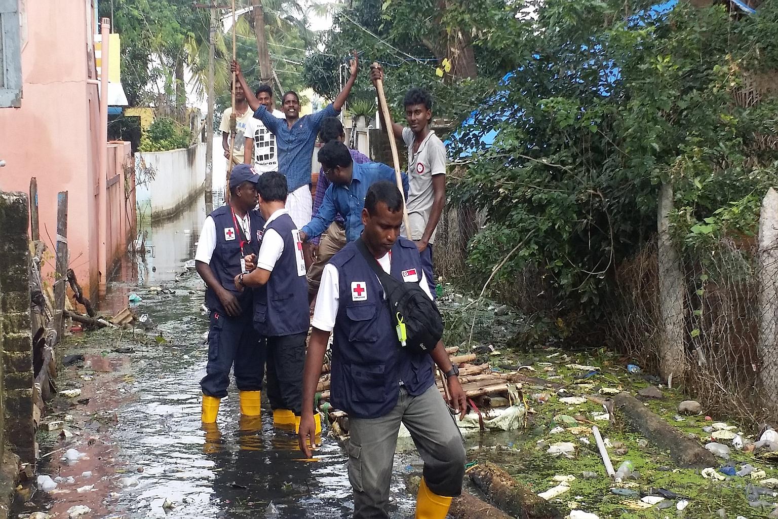 A Singapore Red Cross Response Team surveying the situation in Thiruninravur, Chennai.
