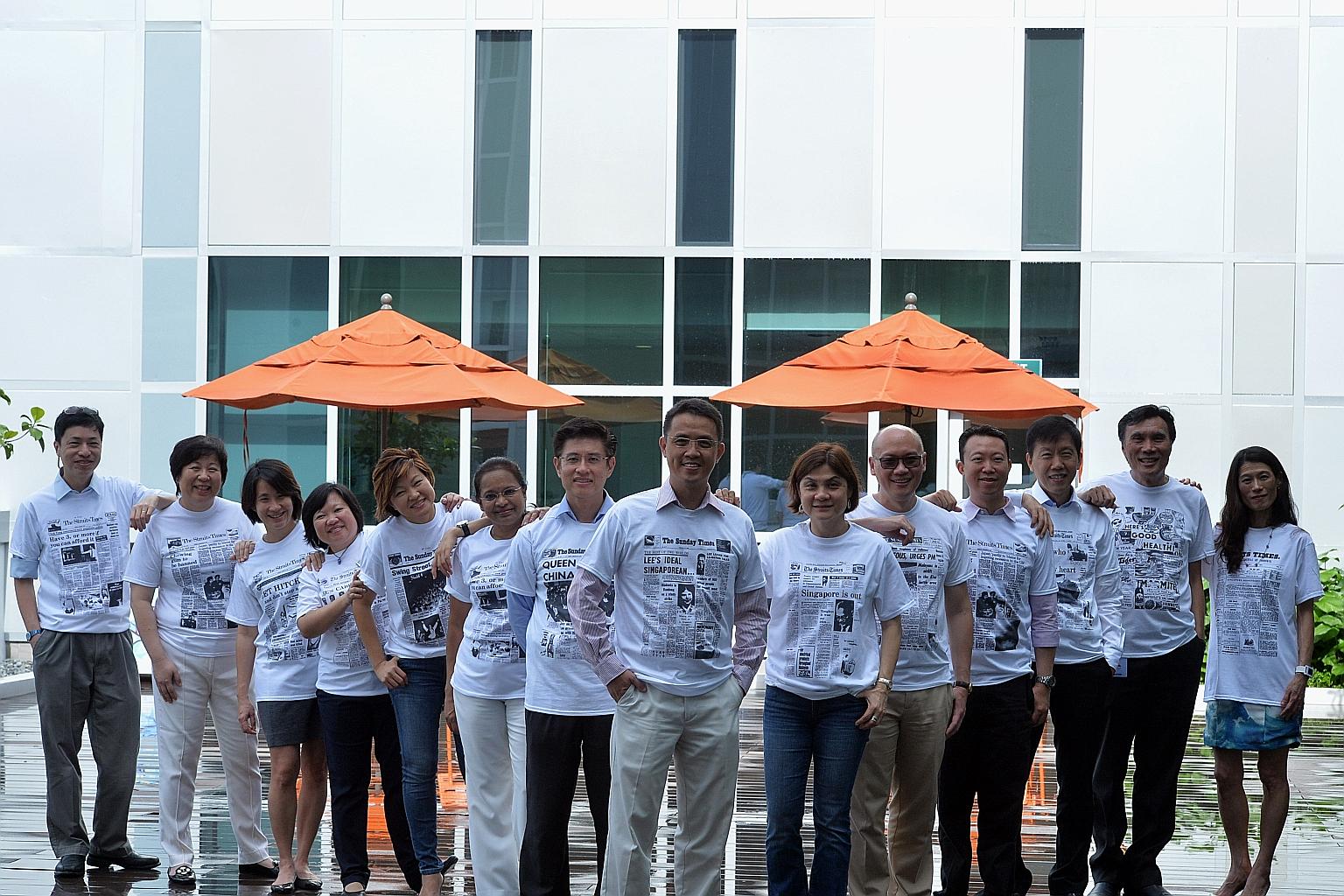 JurongHealth Services CEO Foo Hee Jug (eighth from left) with some of the recipients of The Straits Times 170th anniversary T-shirts, including JurongHealth medical board chairman Cheah Wei Keat (seventh from left) and Dr Thomas Soo (second from righ