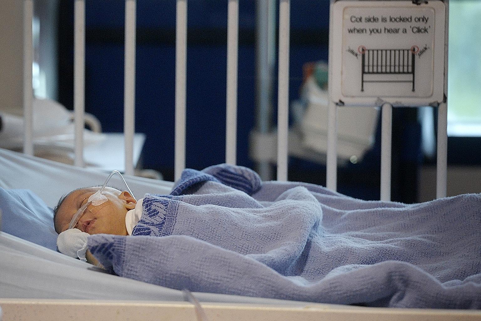 Baby Jeslyn is being kept under observation after KKH doctors removed a large tumour from the base of her spine on Dec 4.