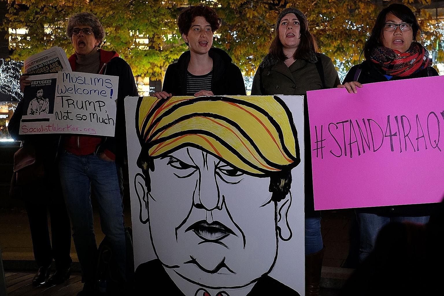 Activists and people from the Muslim community displaying a placard depicting US presidential hopeful Trump during a demonstration in New York on Dec 10 for Syrian and Iraqi refugees. Muslims are a fundamental part of the US, with millions of them li