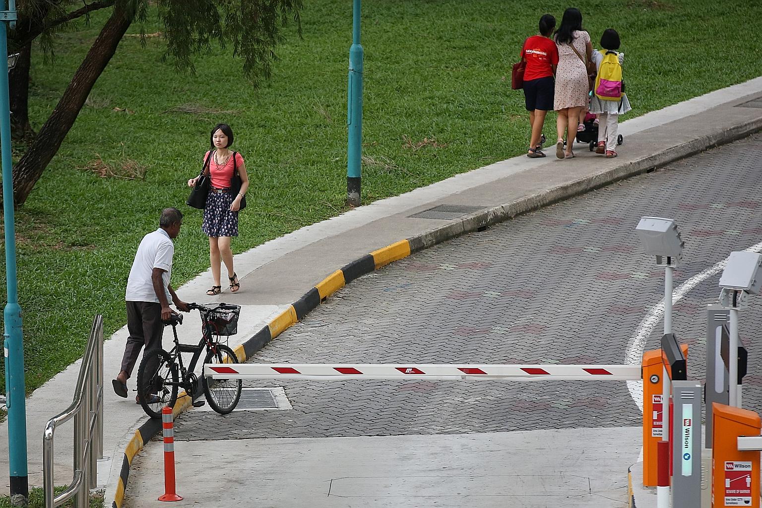 Carparks equipped with bollards and electronic arms that span the length of a lane to stop motorcyclists from slipping in and out without paying can cause blockage for cyclists. Suggestions from a resident to overcome this problem include waiving par