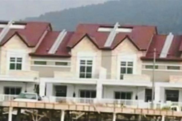 The view of the air wells which resemble crucifixes on the rooftops of a housing project in Kelibang, Langkawi.