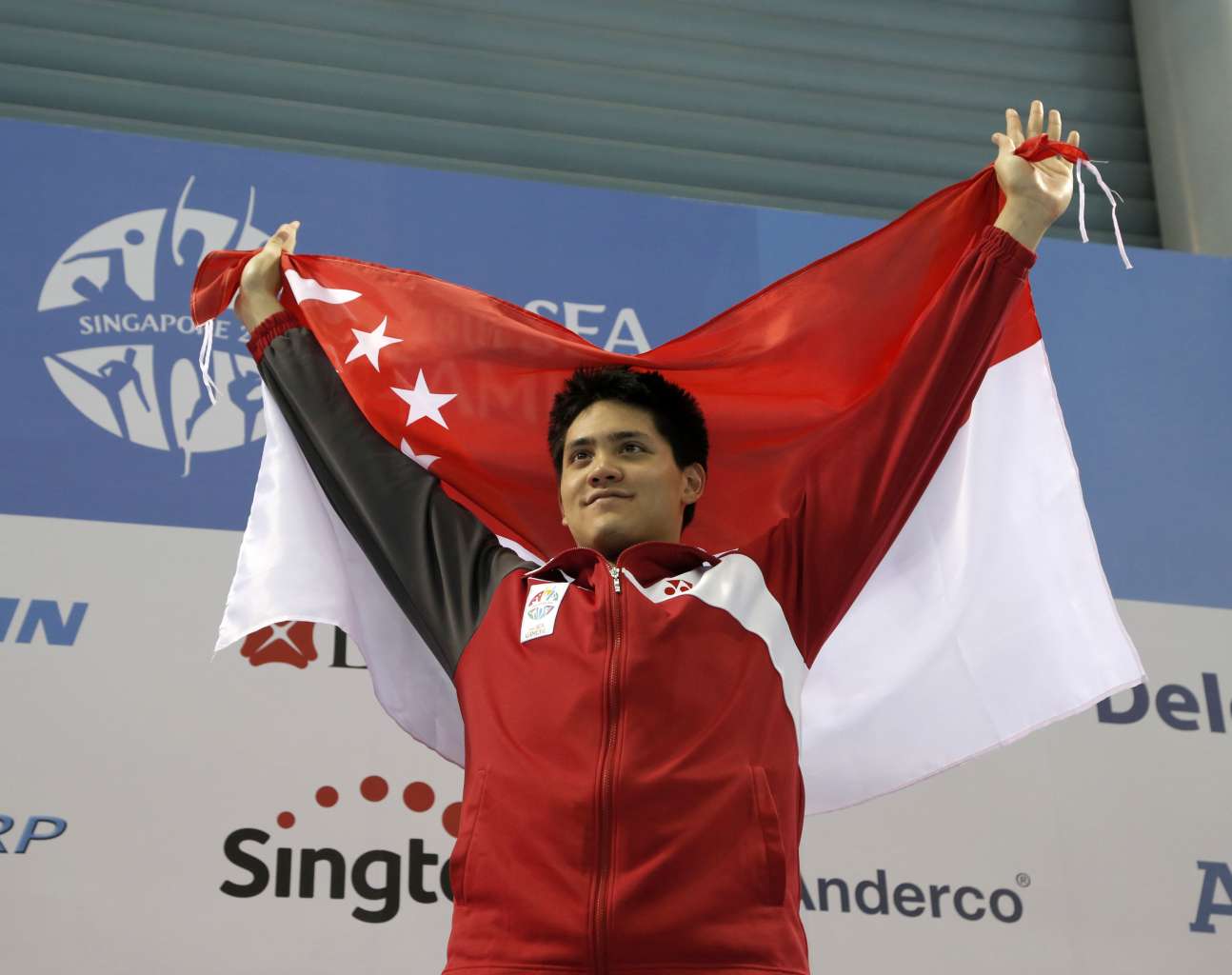 Singapore's Joseph Schooling celebrates winning the gold medal at the 2015 SEA Games in Singapore.