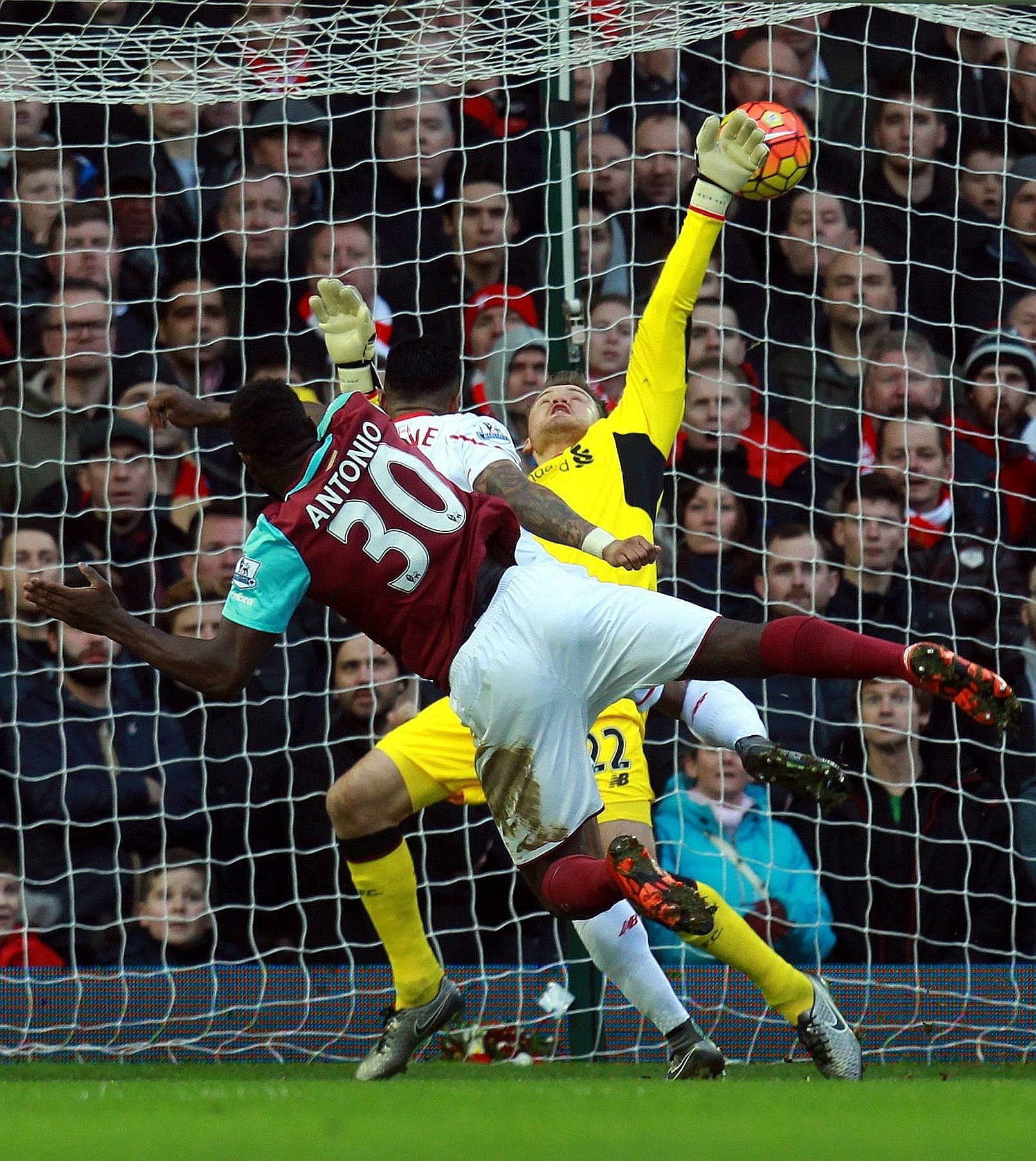 West Ham's Michail Antonio heading past Liverpool goalkeeper Simon Mignolet to open the scoring for the Hammers. Andy Carroll netted a second for the hosts to complete a league double over the Reds.